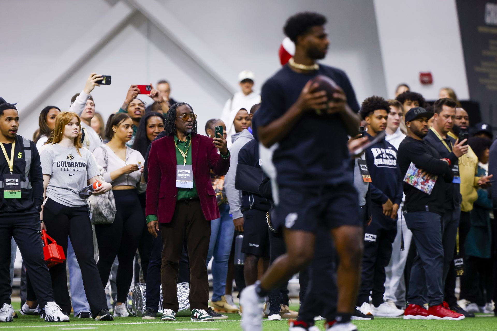 People watch as Colorado Buffaloes quarterback Shedeur Sanders (2) looks to pass the ball at the University of Colorado NFL Showcase at the CU Indoor Practice Facility. Mandatory Credit: Michael Ciaglo-Imagn Images