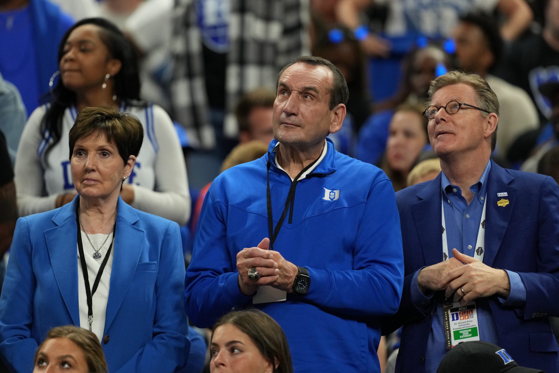 Former Duke Blue Devils men's basketball head coach Mike Krzyzewski, Mickie Krzyzewski and Duke University president Vincent Price look on during the second half in the semifinals of the men's Final Four of the 2025 NCAA Tournament at the Alamodome.