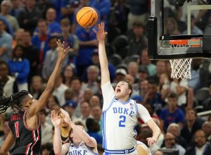 Duke Blue Devils forward Cooper Flagg (2) and Houston Cougars forward Joseph Tugler (11) battle for the ball in the semifinals of the men's Final Four of the 2025 NCAA Tournament at the Alamodome.