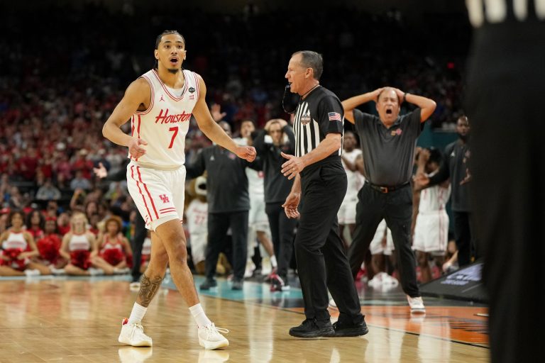Houston Cougars guard Milos Uzan (7) and head coach Kelvin Sampson reacts after a play against the Florida Gators during the second half of the national championship game of the Final Four of the 2025 NCAA Tournament at the Alamodome.
