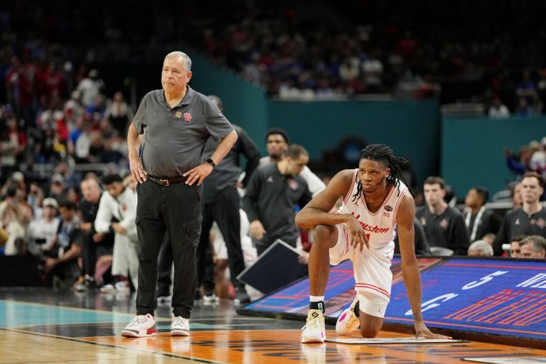 Houston Cougars head coach Kelvin Sampson and forward Joseph Tugler (11) look on against the Florida Gators during the second half of the national championship game of the Final Four of the 2025 NCAA Tournament at the Alamodome.