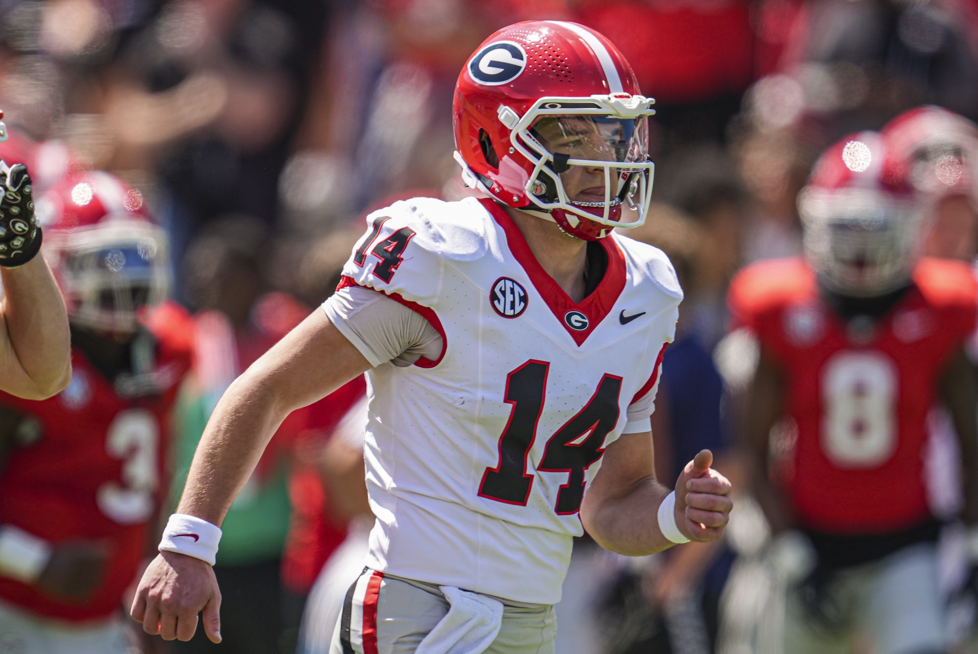 Georgia Bulldogs quarterback Gunner Stockton (14) runs on the field prior to the start of the Georgia Spring game at Sanford Stadium.