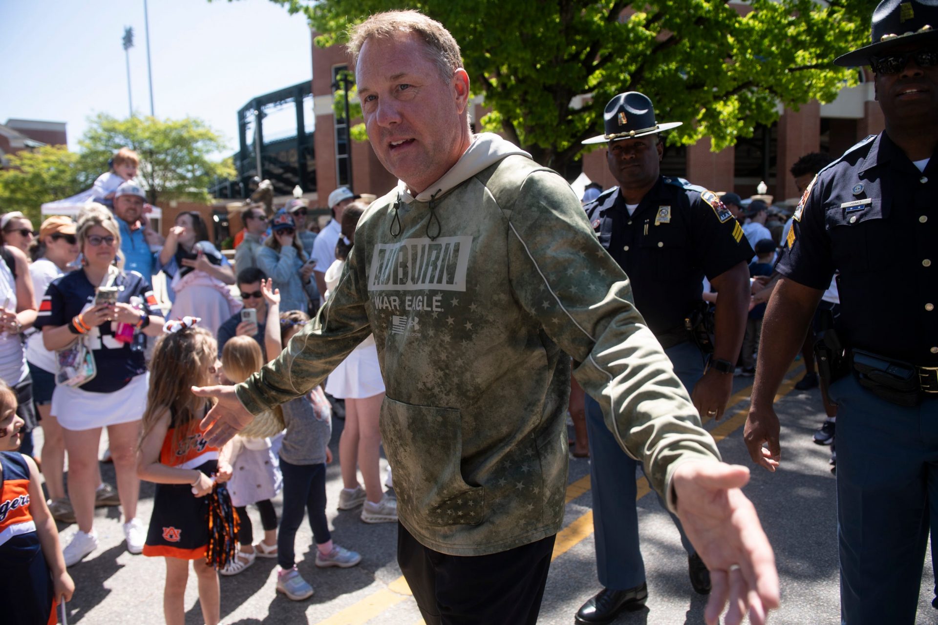 Auburn Tigers head coach Hugh Freeze greets fans during Tiger Walk before Auburn Tigers A-Day football practice at Jordan-Hare Stadium in Auburn, Ala., on Saturday, April 12, 2025.