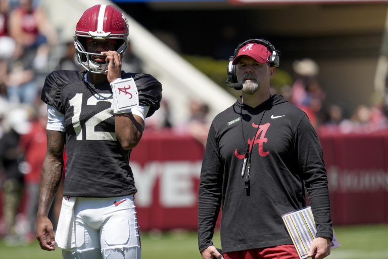 Alabama quarterback Keelon Russell (12) stands with Alabama offensive coordinator Ryan Grubb during A-Day drills at Bryant-Denny Stadium.