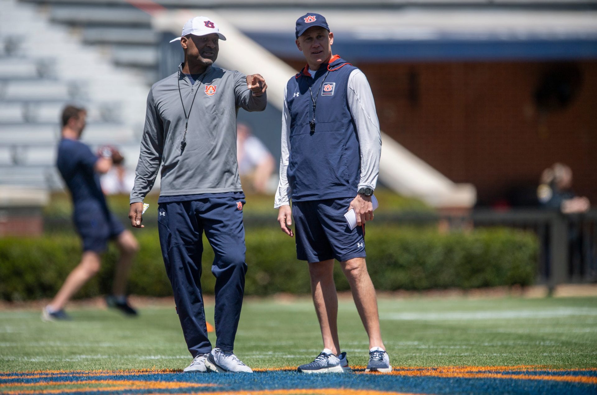 Auburn Tigers offensive coordinator Derrick Nix and Auburn Tigers defensive coordinator DJ Durkin talk during Auburn Tigers A-Day football practice at Jordan-Hare Stadium in Auburn, Ala., on Saturday, April 12, 2025.