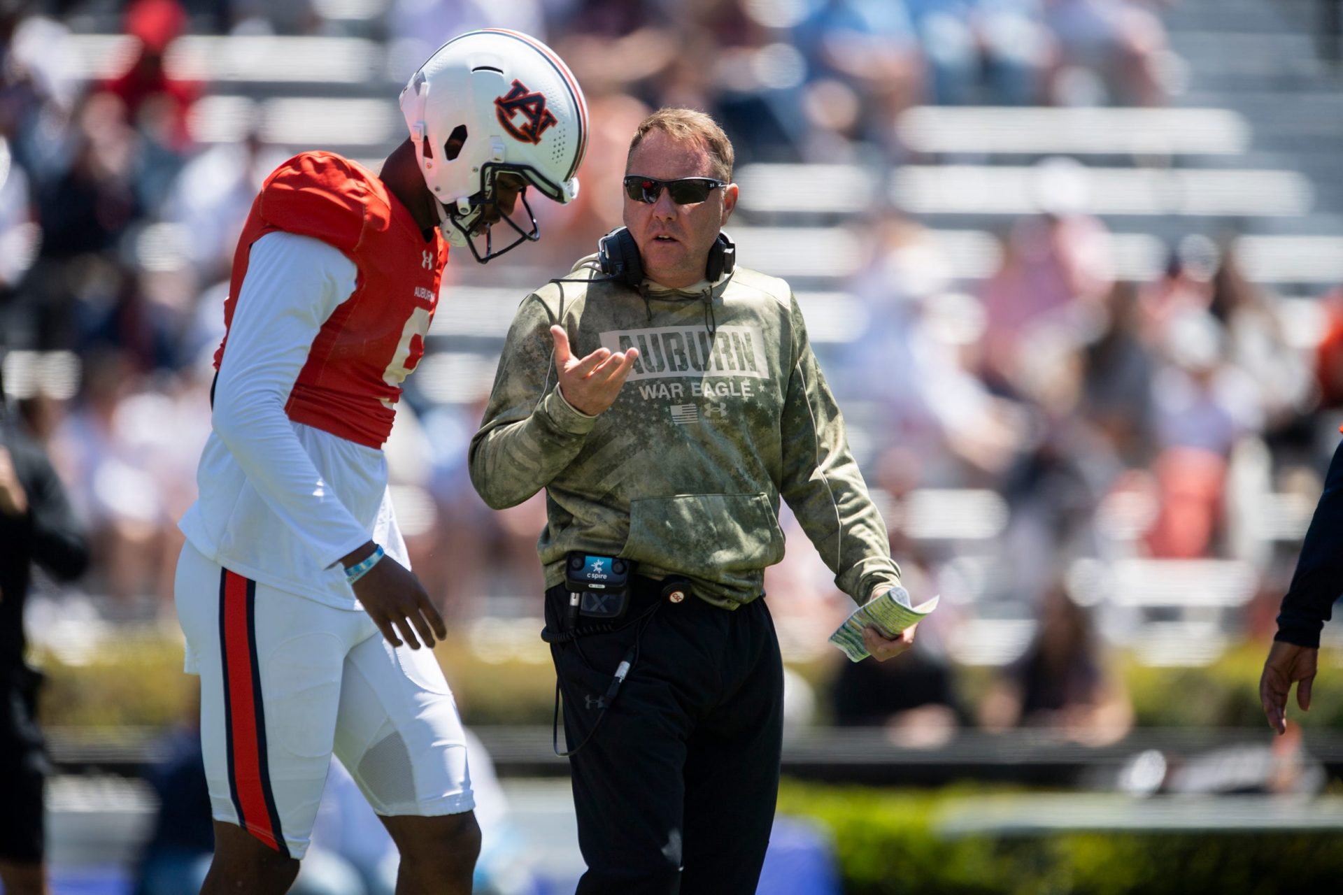 Auburn Tigers head coach Hugh Freeze talks with quarterback Deuce Knight (9) during Auburn Tigers A-Day football practice at Jordan-Hare Stadium in Auburn, Ala., on Saturday, April 12, 2025.