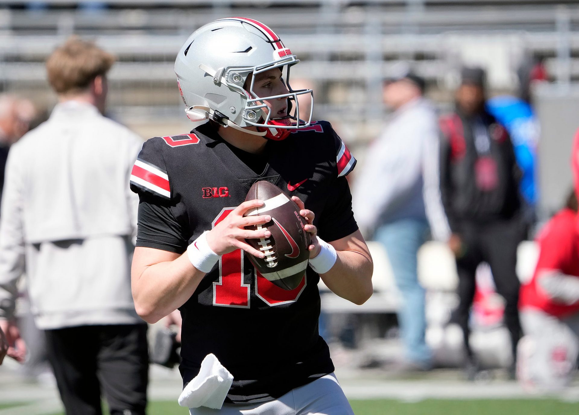 Ohio State Buckeye quarterback Julian Sayin (10) warms up before the start of the spring game