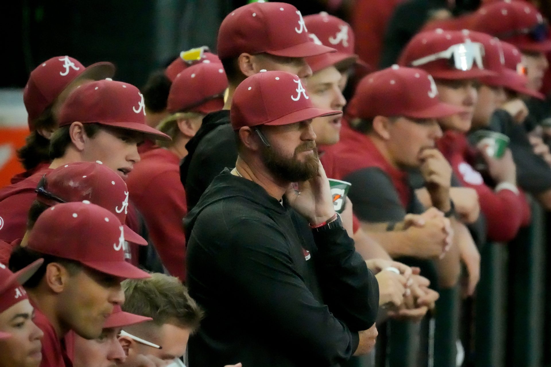 Alabama head coach Rob Vaughn watches the game progress from the dugout as the Tide played UAB at Sewell-Thomas Stadium