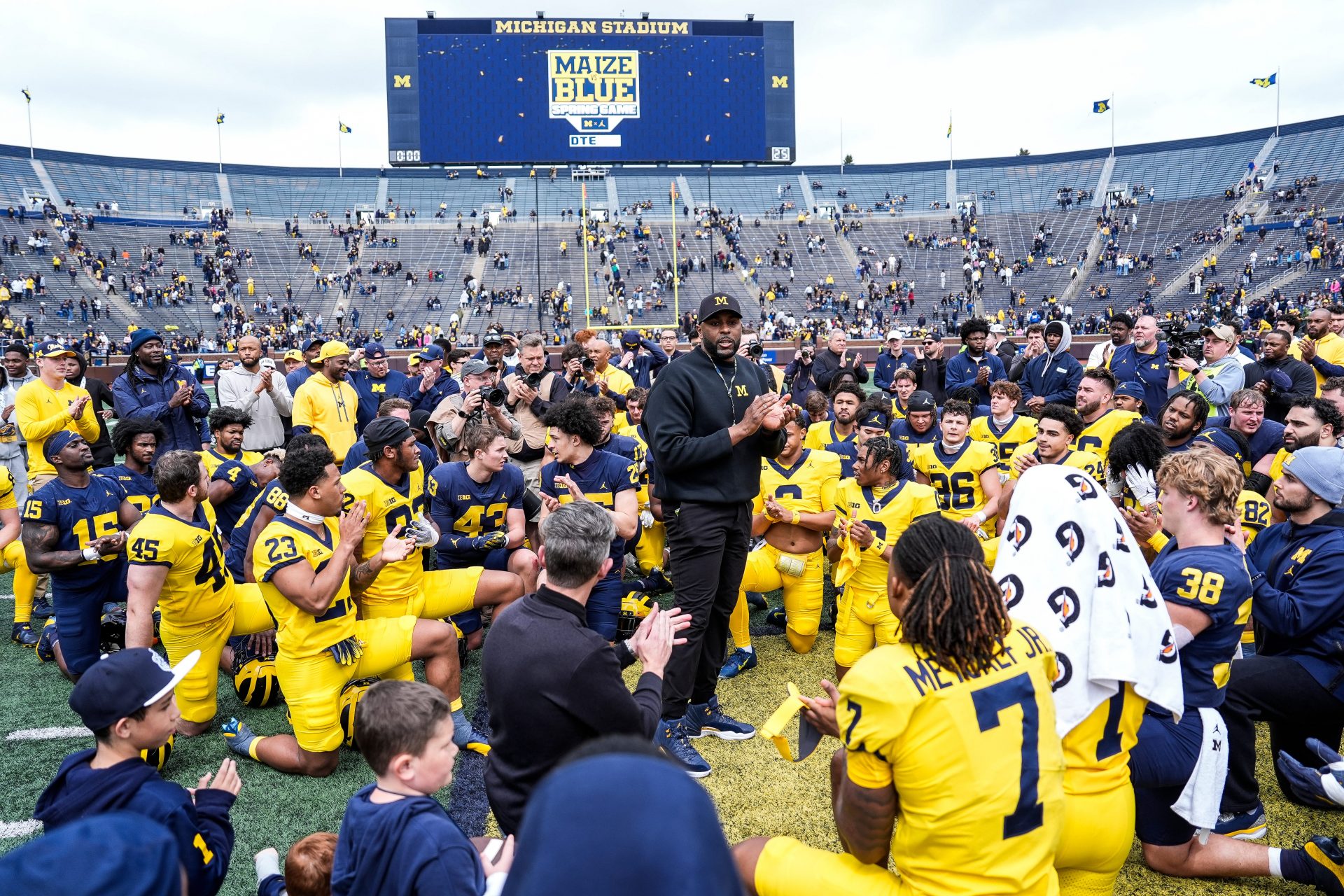 Michigan head coach Sherrone Moore, center, speaks to players after the spring game at Michigan Stadium in Ann Arbor on Saturday, April 19, 2025.