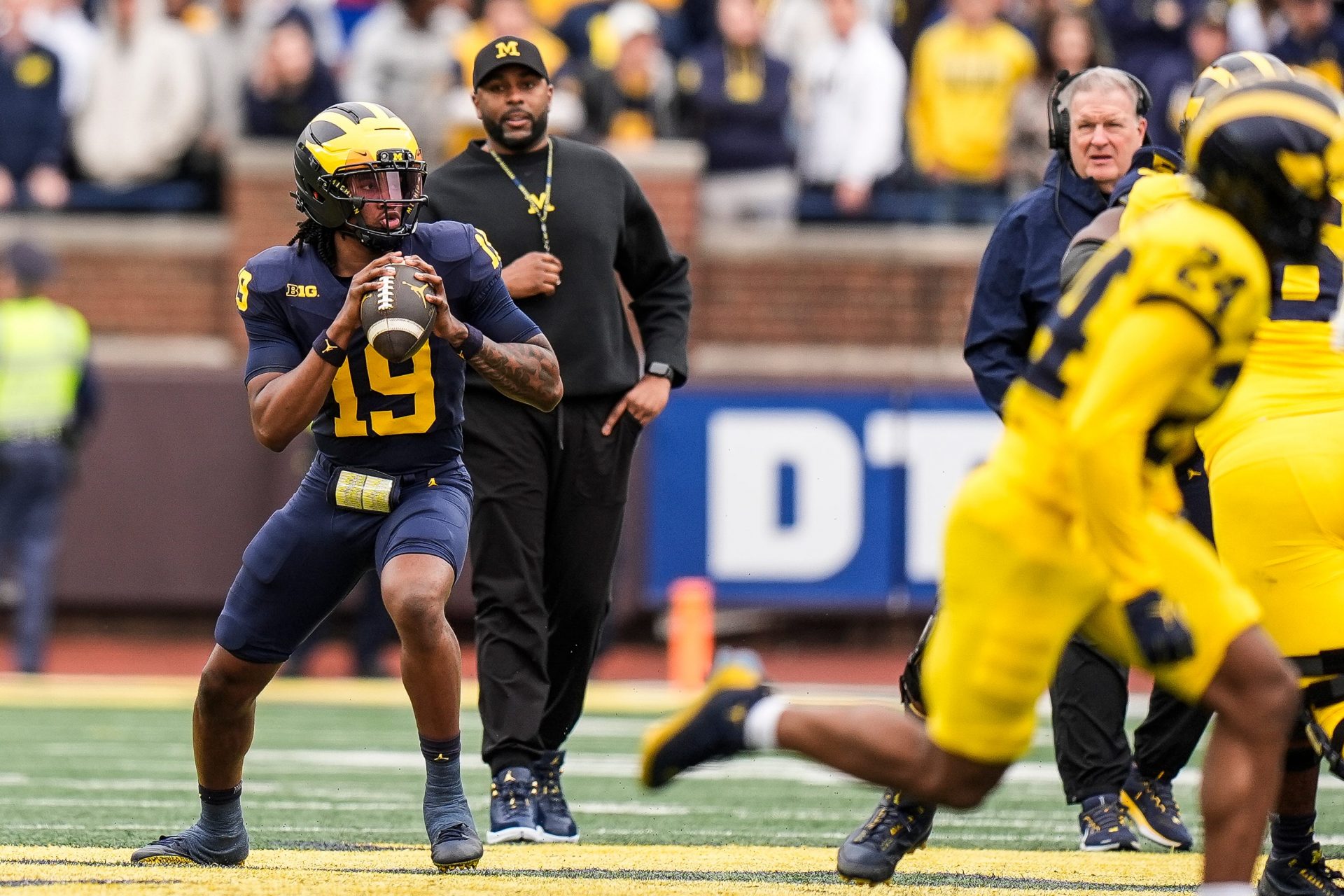 Michigan head coach Sherrone Moore watches quarterback Bryce Underwood (19) during the first half of the spring game at Michigan Stadium in Ann Arbor on Saturday, April 19, 2025.
