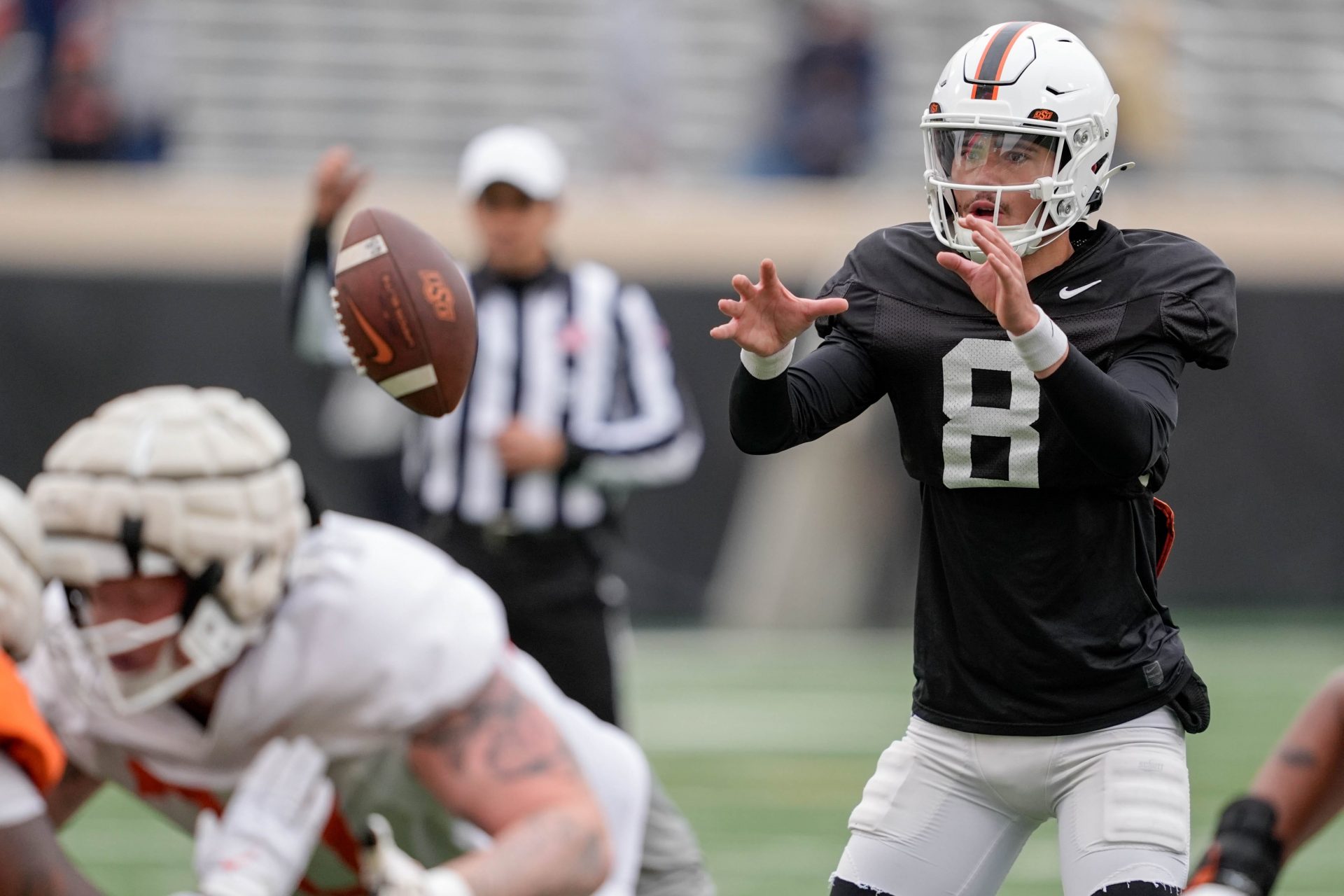 Oklahoma State quarterback Maealiuaki Smith (8) takes a snap during an Oklahoma State spring football showcase at Boone Pickens Stadium in Stillwater, Okla., Saturday, April 19, 2025.
