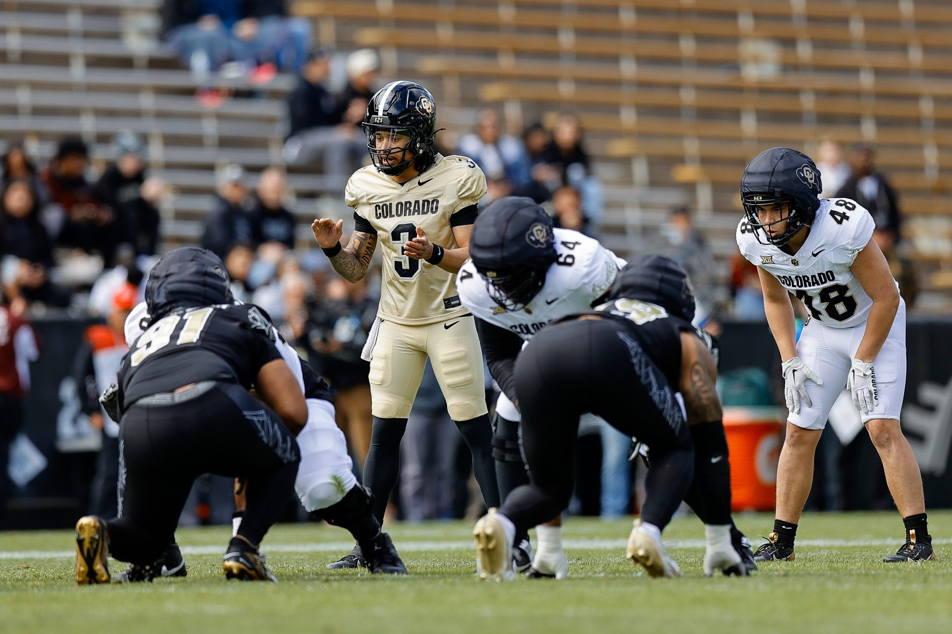 Colorado Buffaloes quarterback Kaidon Salter (3) and running back Christian Sarem (48) during the spring game at Folsom Field.