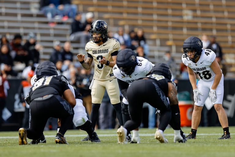 Colorado Buffaloes quarterback Kaidon Salter (3) and running back Christian Sarem (48) during the spring game at Folsom Field.