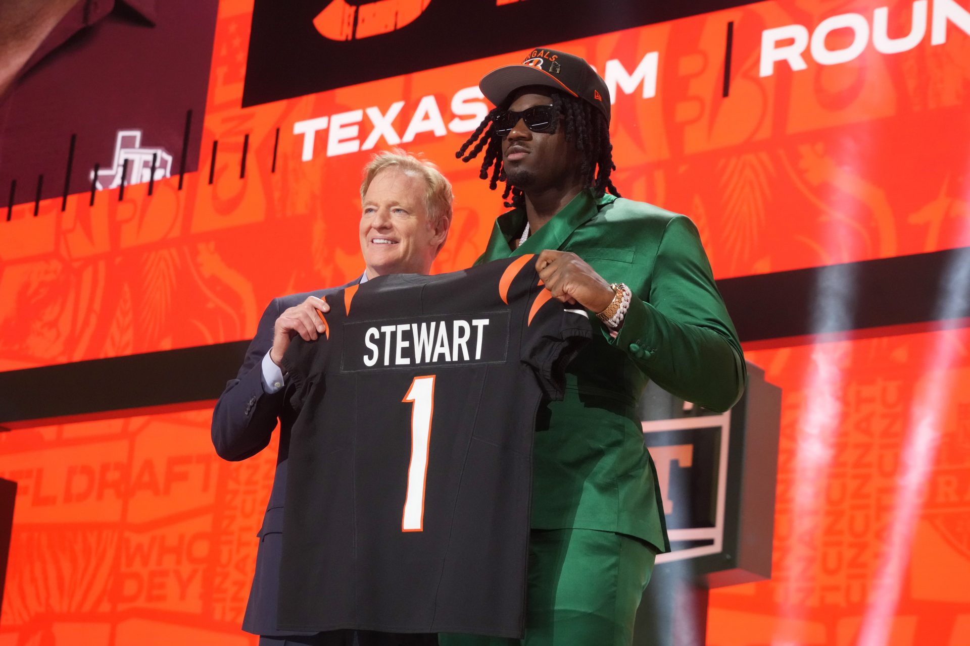 NFL commissioner Roger Goodell with Texas A&M Aggies defensive end Shemar Stewart after her is selected by the Cincinnati Bengals as the number seventeen pick in the first round of the 2025 NFL Draft at Lambeau Field.