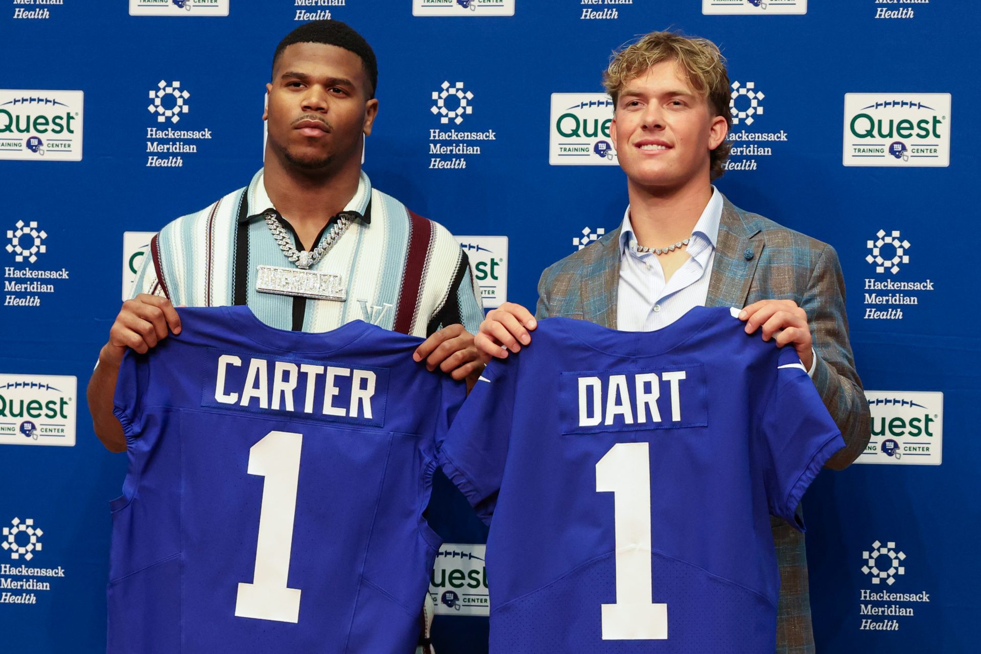 New York Giants first round draft picks, Abdul Carter and Jaxson Dart pose for photos prior to the start of the press conference.