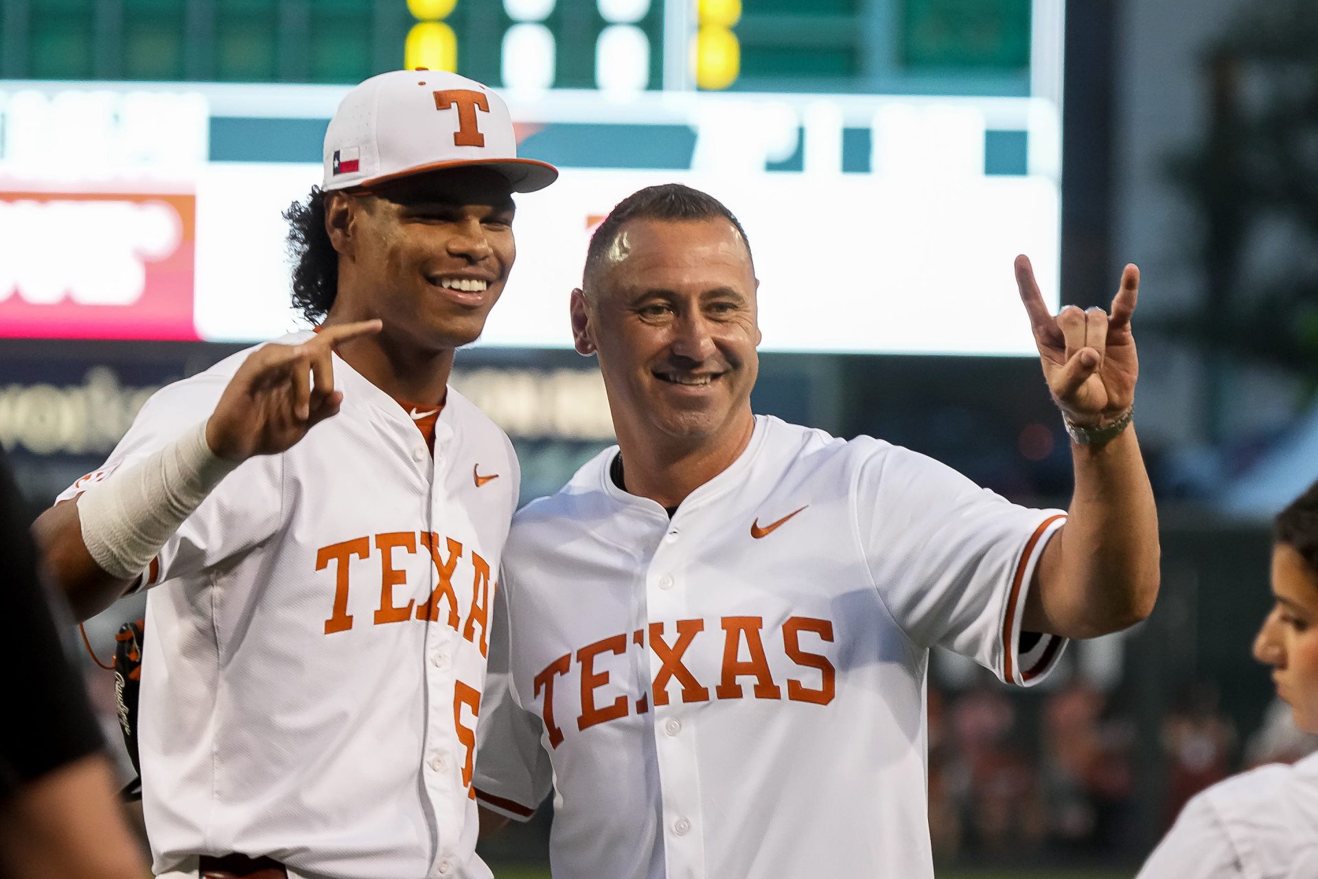 Texas Longhorns head football coach Steve Sarkisian takes a photo with pitcher Jonah Williams (55) ahead of the Lone Star Showdown against Texas A&M at UFCU Disch-Falk Field on Friday, April 25, 2025.