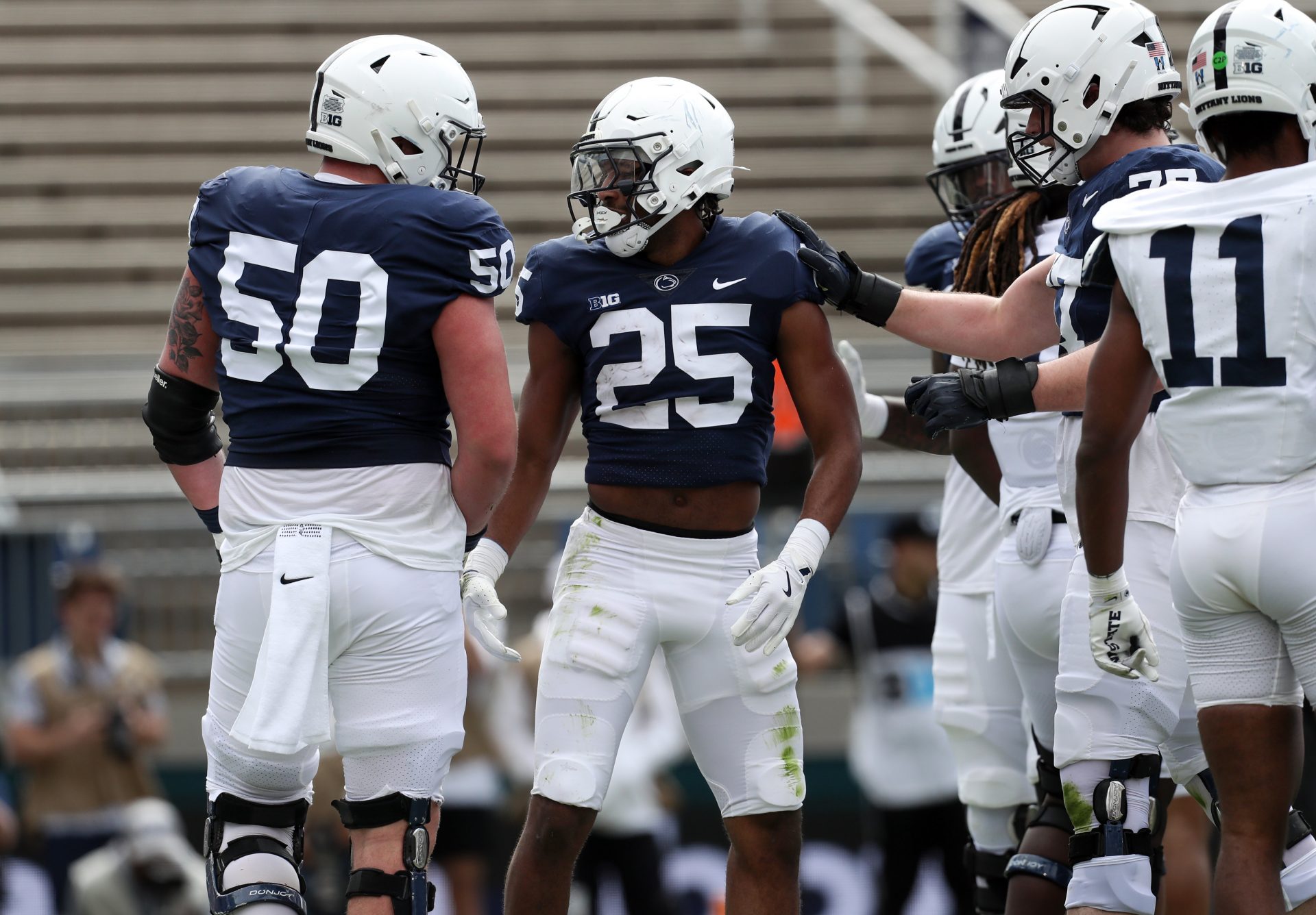 Penn State Nittany Lions Quinton Martin Jr (25) celebrates with his teammates after scoring a touchdown during the third quarter of the Blue White spring game at Beaver Stadium. The White team defeated the Blue team 10-8.