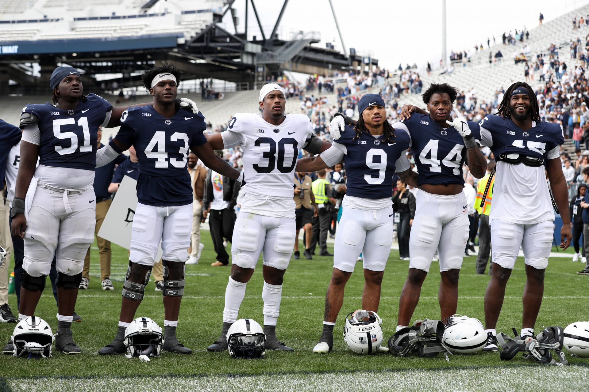 The Penn State Nittany Lion players sing their alma mater following the Blue White spring game at Beaver Stadium. The White team defeated the Blue team 10-8.