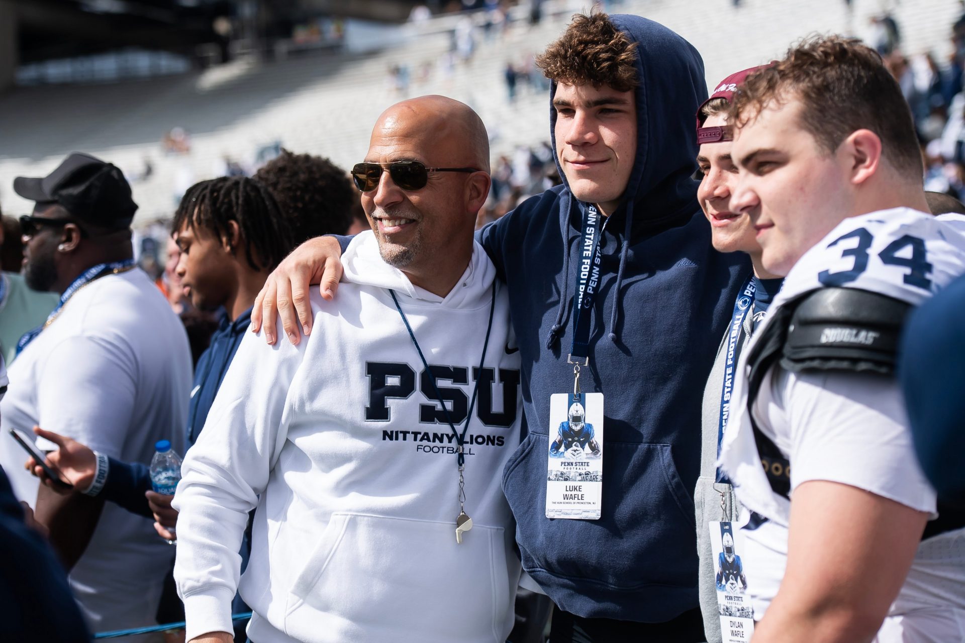 Penn State football head coach James Franklin takes a photo with recruit Luke Wafle and the Wafle family, including defensive tackle Owen Wafle (34), following the Blue-White game at Beaver Stadium on Saturday, April 26, 2025, in State College. The White team defeated the Blue team, 10-8.