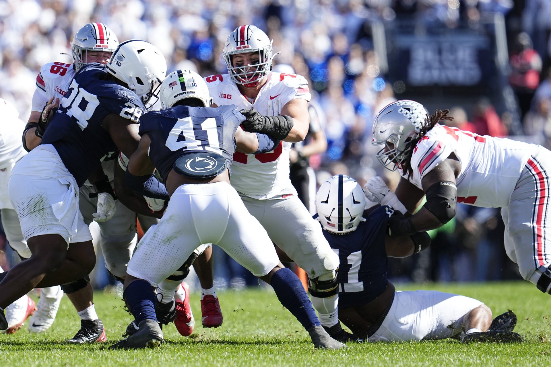 Ohio State Buckeyes offensive linemen Seth McLaughlin (56), Carson Hinzman (75) and Donovan Jackson (74) block during the NCAA football game against the Penn State Nittany Lions at Beaver Stadium in University Park, Pa. on Monday, Nov. 4, 2024. Ohio State won 20-13.