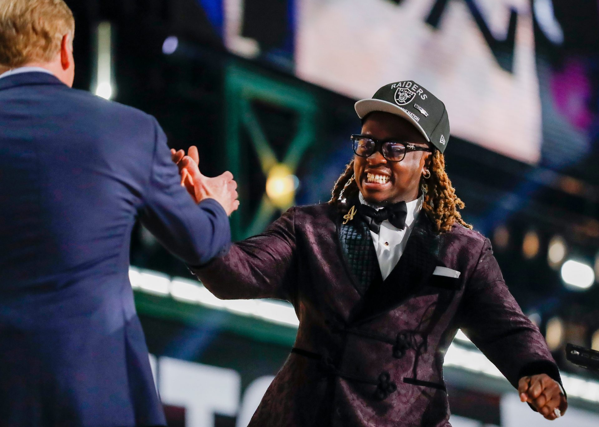 Running back Ashton Jeanty slaps hands with NFL Commissioner Roger Goodell after being selected sixth overall by the Las Vegas Raiders during the first round of the 2025 NFL Draft on Thursday, April 24, 2025, at Lambeau Field in Green Bay, Wisconsin. The draft runs through April 26.