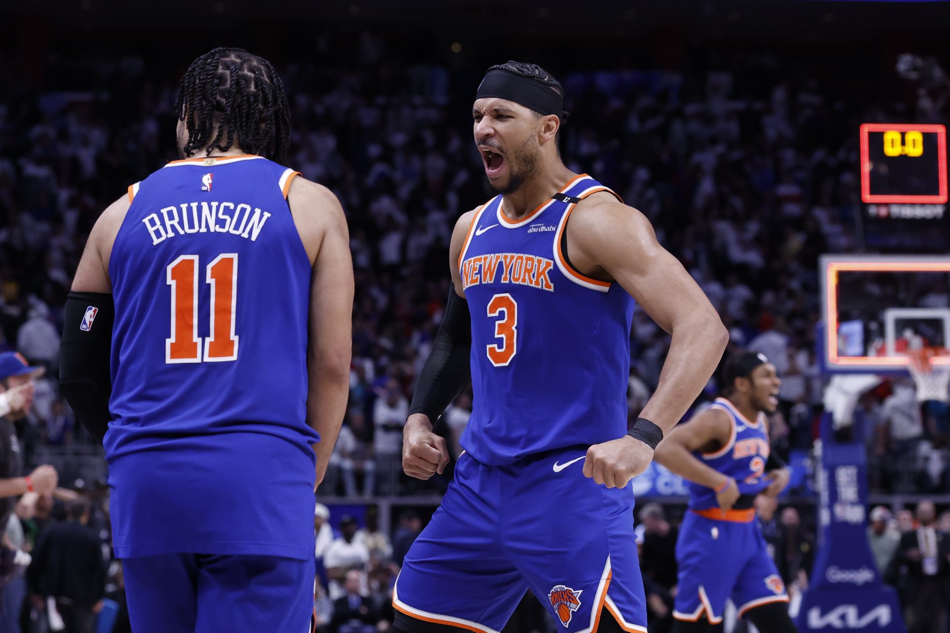 New York Knicks guard Jalen Brunson (11) and guard Josh Hart (3) celebrate after defeating the Detroit Pistons during game six of first round for the 2024 NBA Playoffs at Little Caesars Arena.