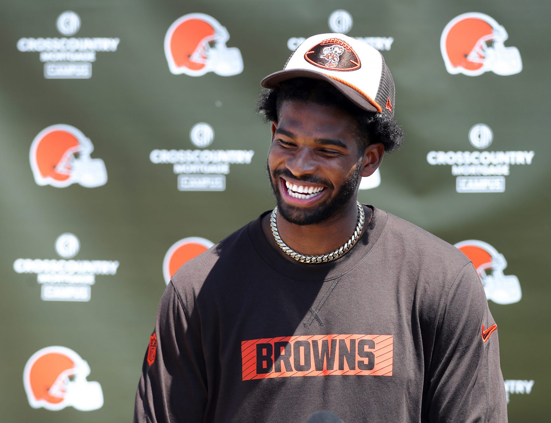 Cleveland Browns quarterback Shedeur Sanders (12) jokes about his signing bonus during a press conference before day two of NFL rookie minicamp at the Cleveland Browns training facility on Saturday, May 10, 2025, in Berea, Ohio.