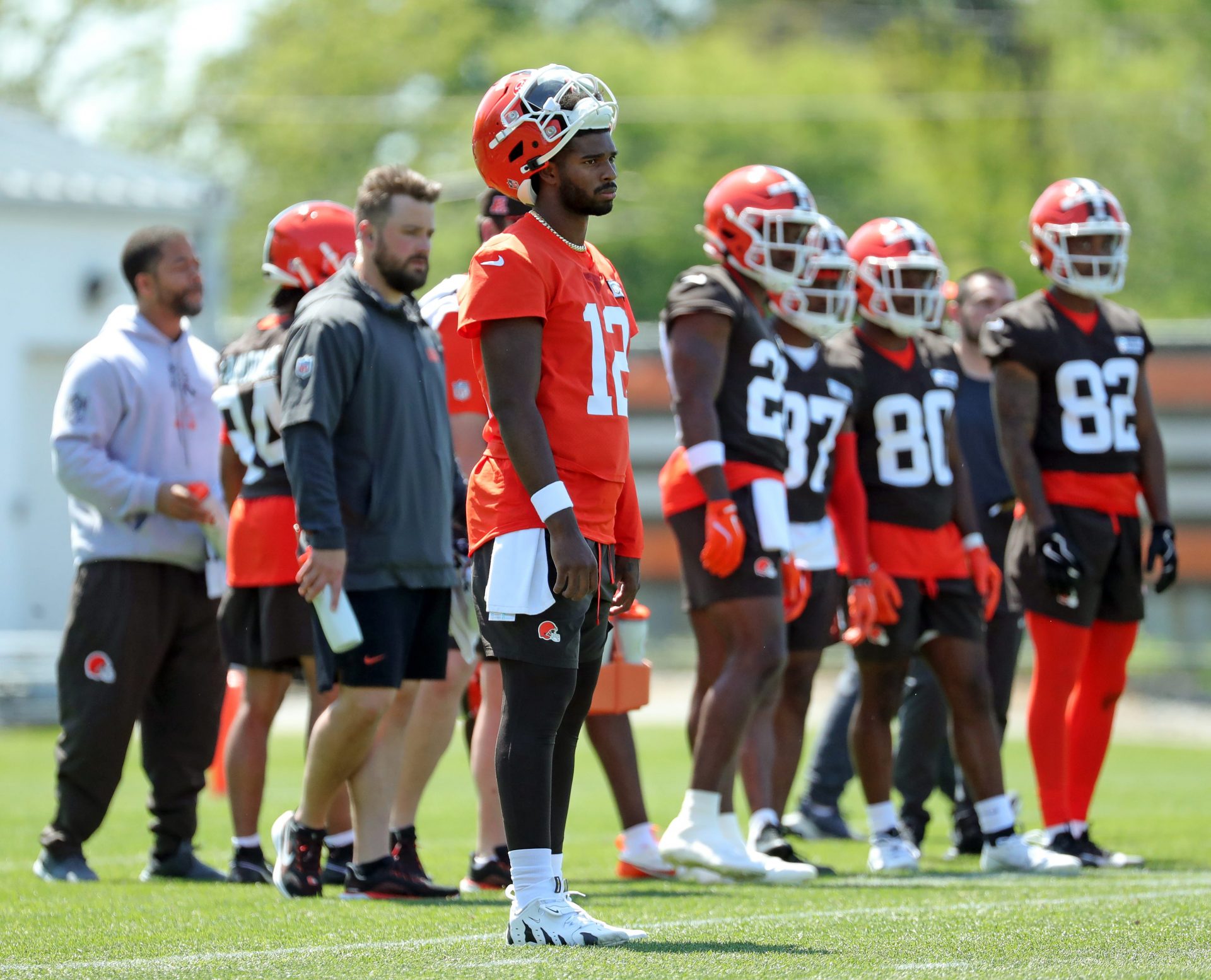 Cleveland Browns quarterback Shedeur Sanders (12) watches from the sideline during day two of NFL rookie minicamp at the Cleveland Browns training facility on Saturday, May 10, 2025, in Berea, Ohio.