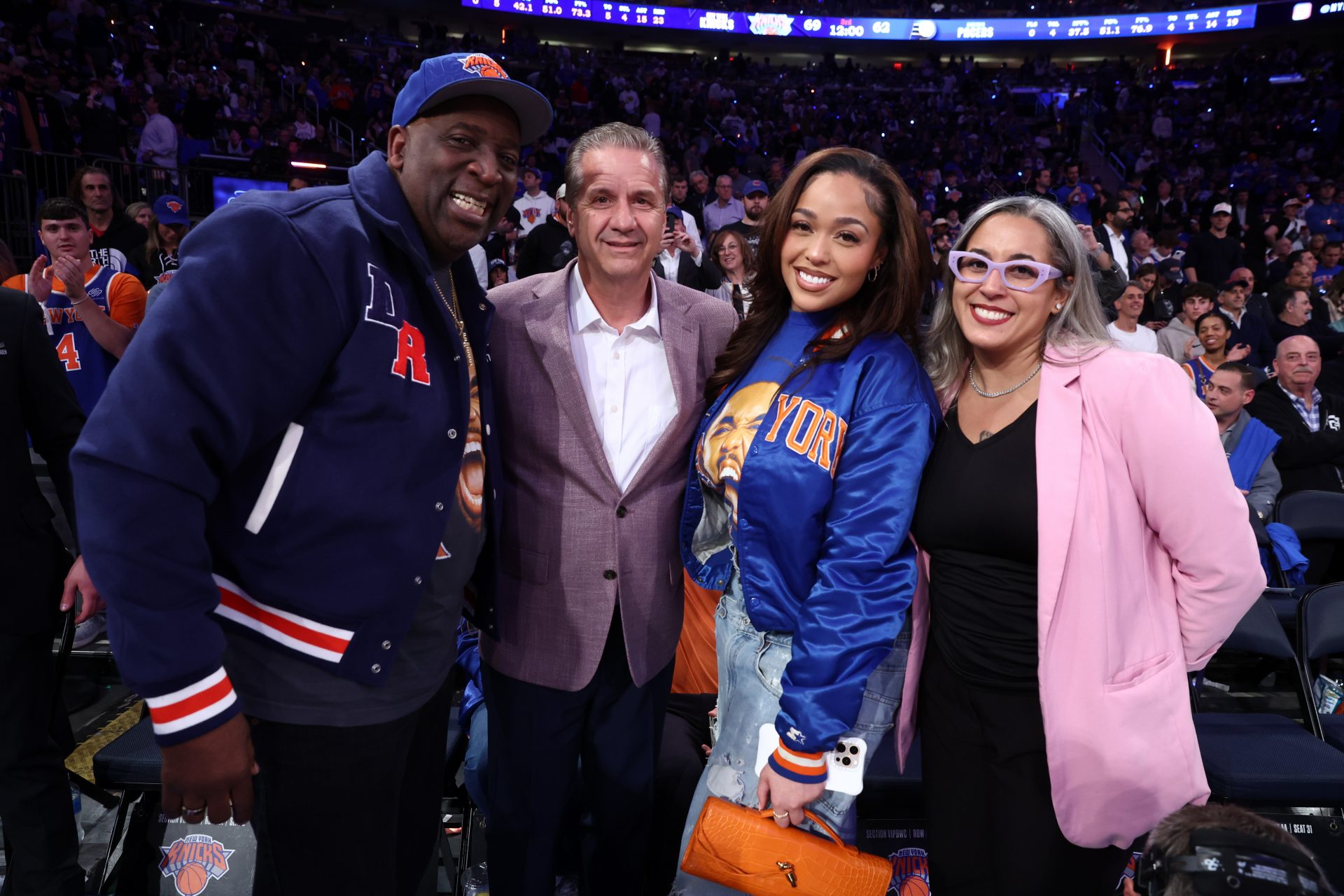 John Calipari poses for a photo with New York Knicks center Karl-Anthony Towns (32) girlfriend Jordyn Woods and his father Karl Towns Senior before the third quarter between the Indiana Pacers and the New York Knicks during game one of the eastern conference finals for the 2025 NBA Playoffs at Madison Square Garden.