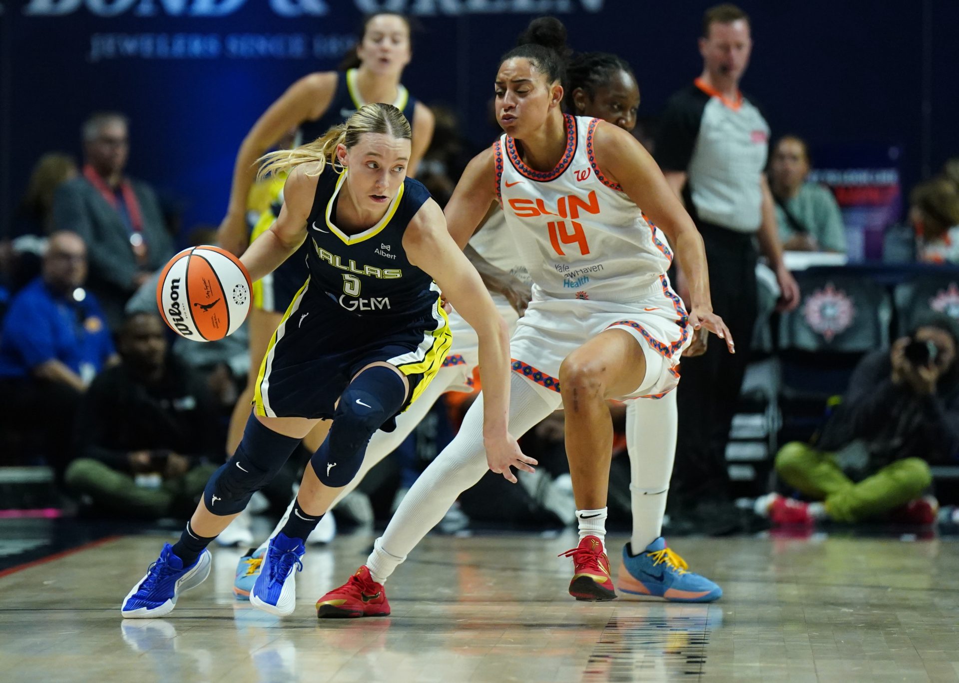 Dallas Wings guard Paige Bueckers (5) drives the ball against Connecticut Sun guard Bria Hartley (14) in the second half at Mohegan Sun Arena.