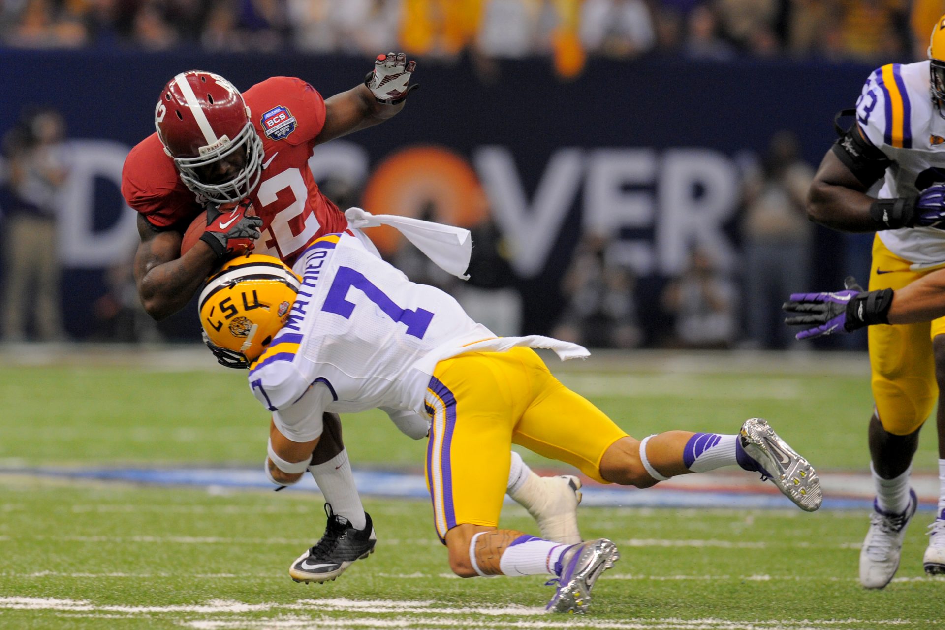 LSU Tigers cornerback Tyrann Mathieu (7) tackles Alabama Crimson Tide running back Eddie Lacy (42) during the first half of the 2012 BCS National Championship game at the Mercedes-Benz Superdome.