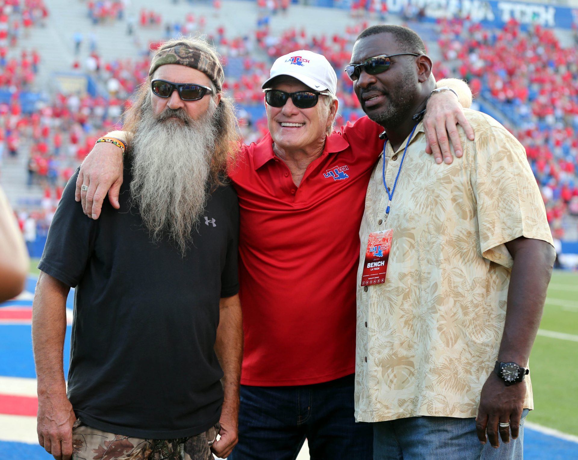 Television personality Phil Robertson (left) and NFL former quarterbacks Doug Williams and Terry Bradshow on the sidelines before the the Louisiana Tech Bulldogs game against the Tulane Green Wave at Joe Aillet Stadium.