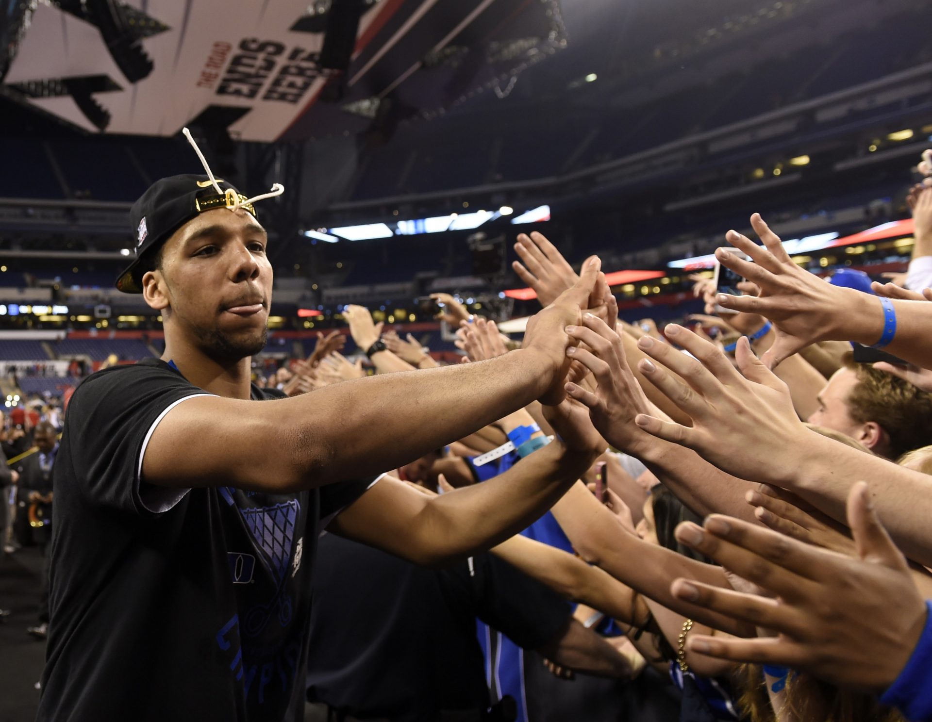 Duke Blue Devils center Jahlil Okafor celebrates with fans after defeating the Wisconsin Badgers the 2015 NCAA Men's Division I Championship game at Lucas Oil Stadium.