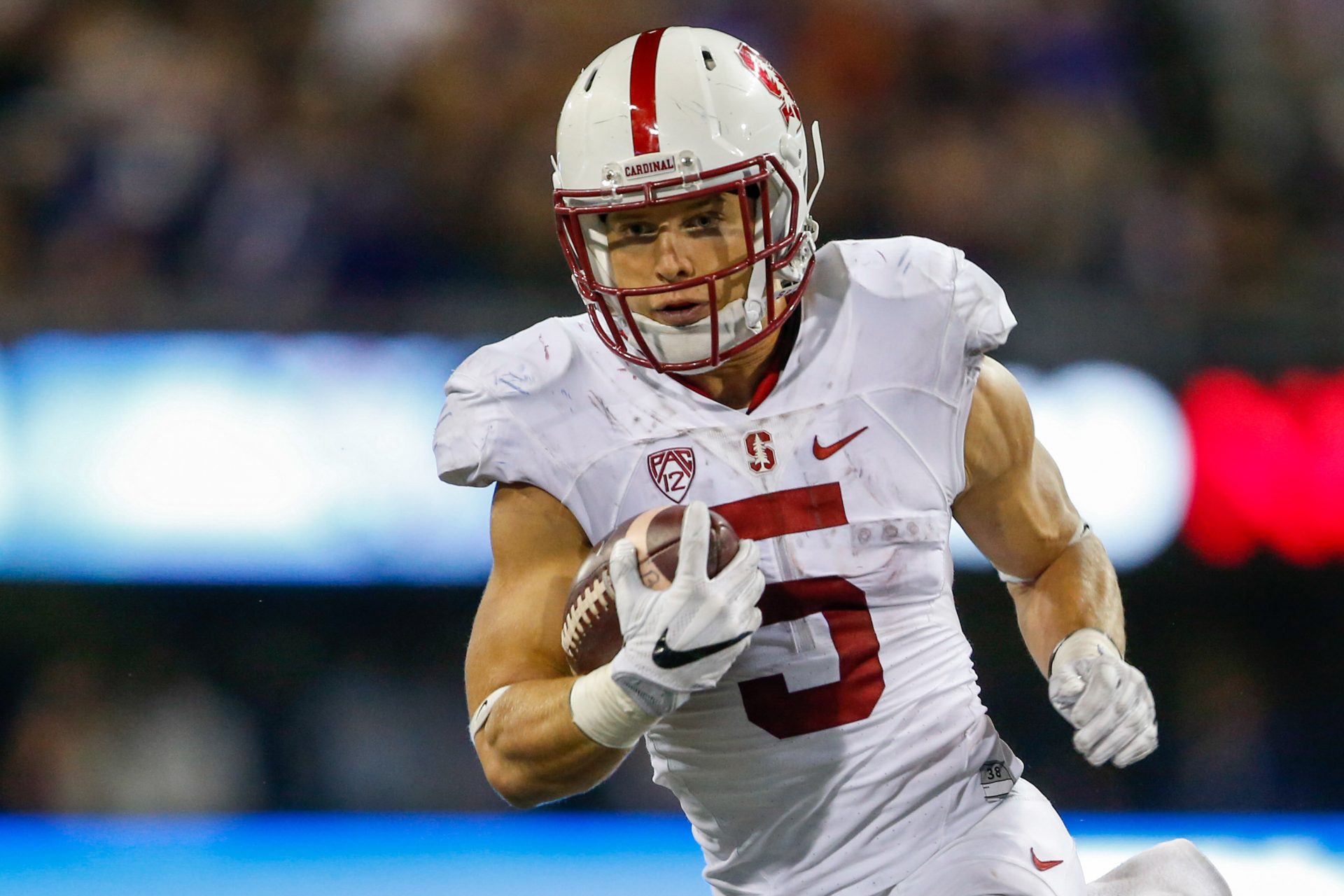 Stanford Cardinal running back Christian McCaffrey (5) rushes the ball against the Washington Huskies during the second half at Husky Stadium. Washington won 44-6.