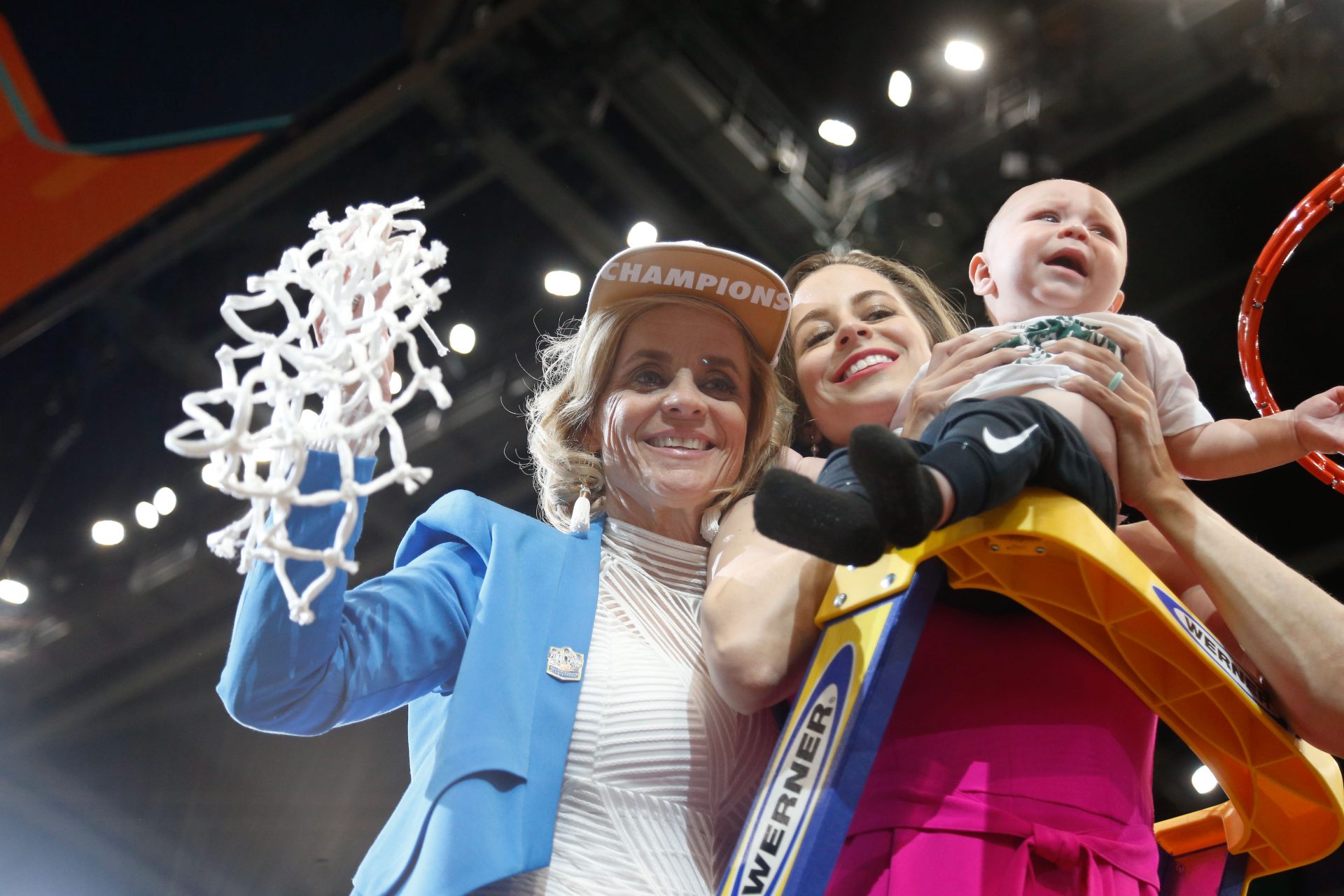 Baylor Lady Bears head coach Kim Mulkey and daughter Makenzie Fuller cut the net after defeating Notre Dame Fighting Irish to win the championship game of the women's Final Four of the 2019 NCAA Tournament at Amalie Arena.