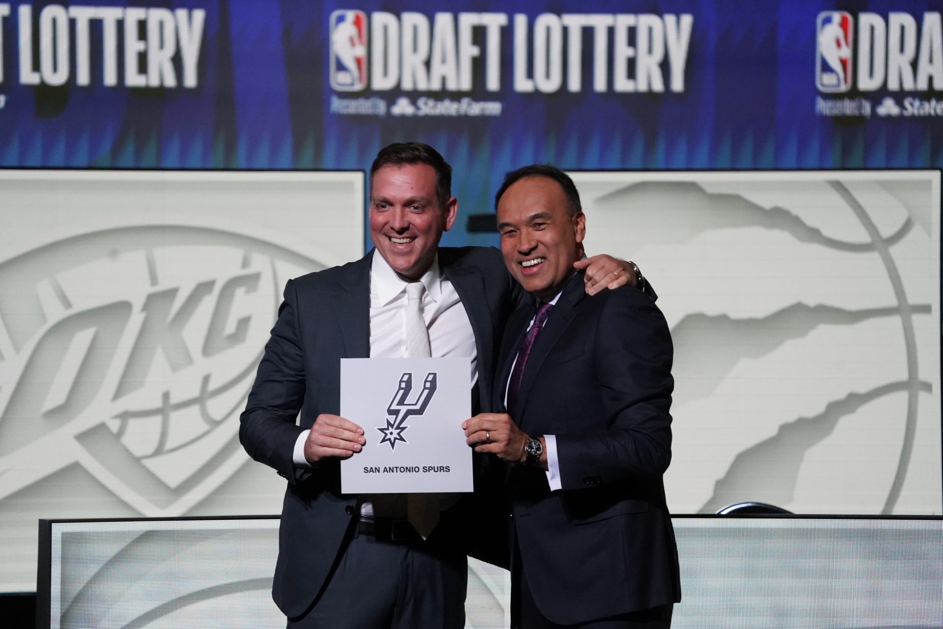 NBA Deputy Commissioner Mark Tatum (right) congratulates San Antonio Spurs managing partner Peter J. Holt (left) the first pick in the 2023 NBA Draft Lottery at McCormick Place West.