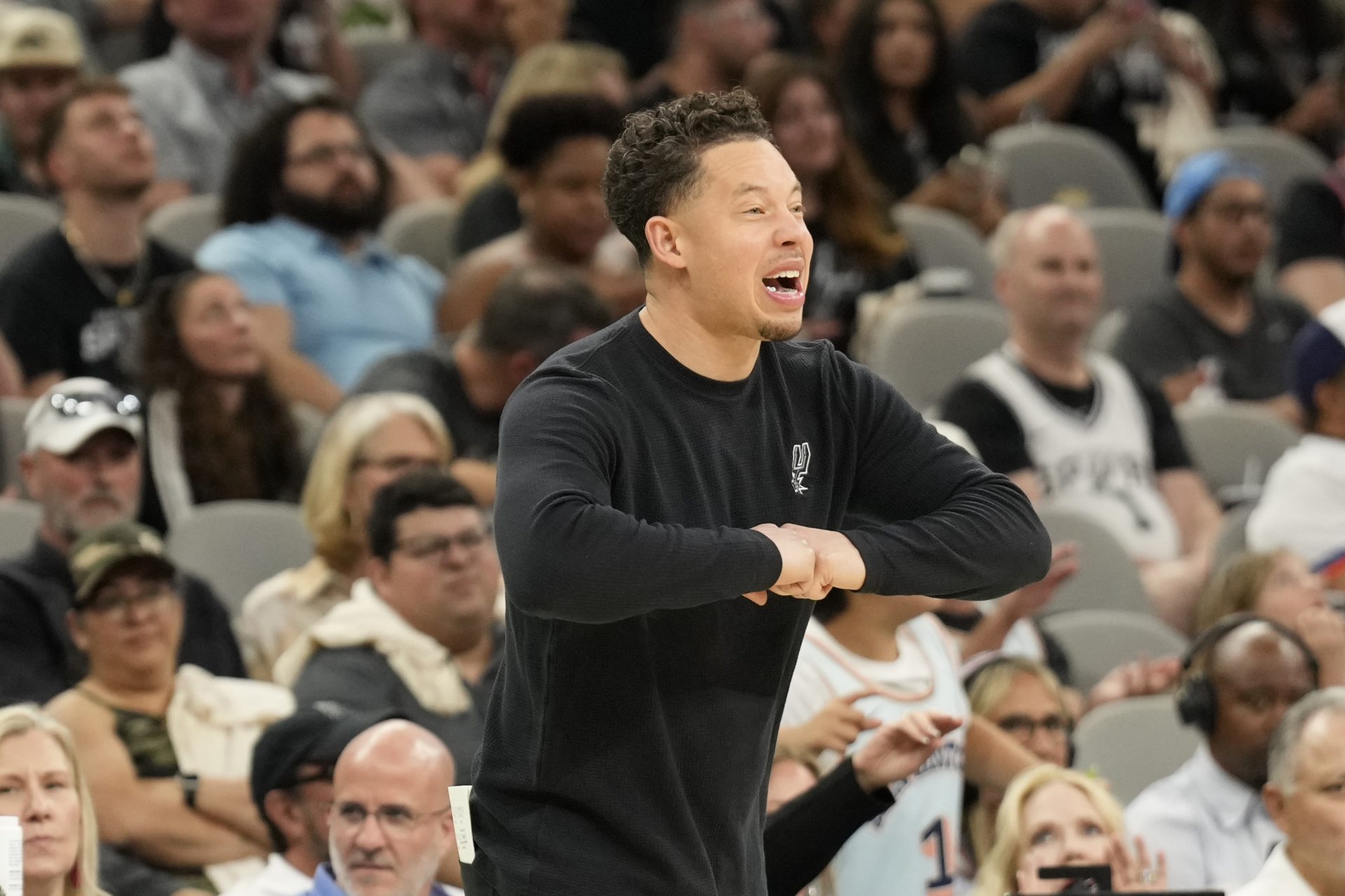San Antonio Spurs interim coach Mitch Johnson signals to players during the second half against the Toronto Raptors at Frost Bank Center.