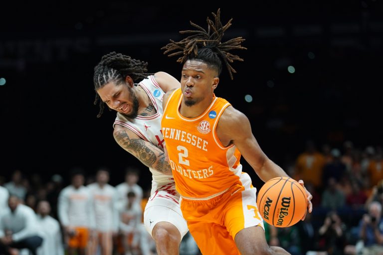 Tennessee Volunteers guard Chaz Lanier (2) dribbles the ball against Houston Cougars guard Emanuel Sharp (21) in the first half during the Midwest Regional final of the 2025 NCAA tournament at Lucas Oil Stadium.