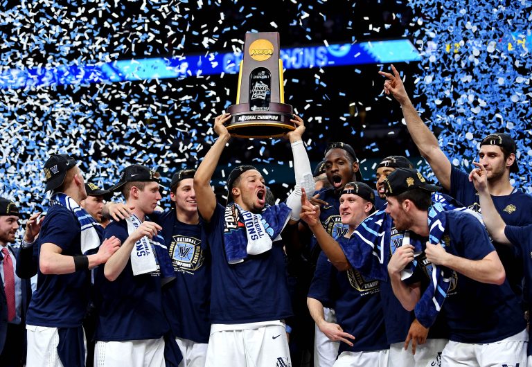 Villanova Wildcats guard Jalen Brunson (1) celebrates with the National Championship trophy after beating the Michigan Wolverines in the championship game of the 2018 men's Final Four at Alamodome.