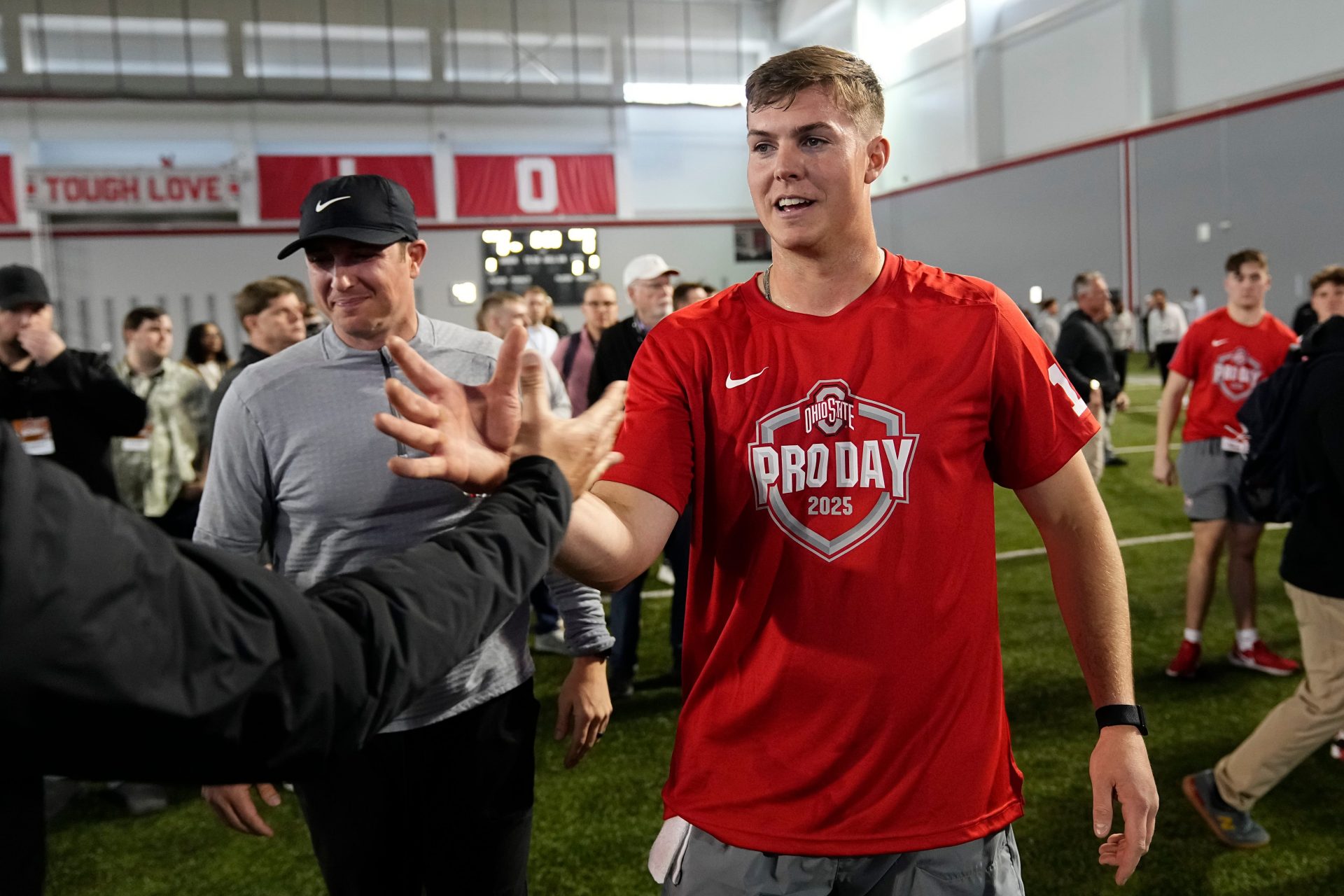 Ohio State Buckeyes quarterback Will Howard gets high fives following his pro day for NFL scouts at the Woody Hayes Athletic Cente on March 26, 2025.