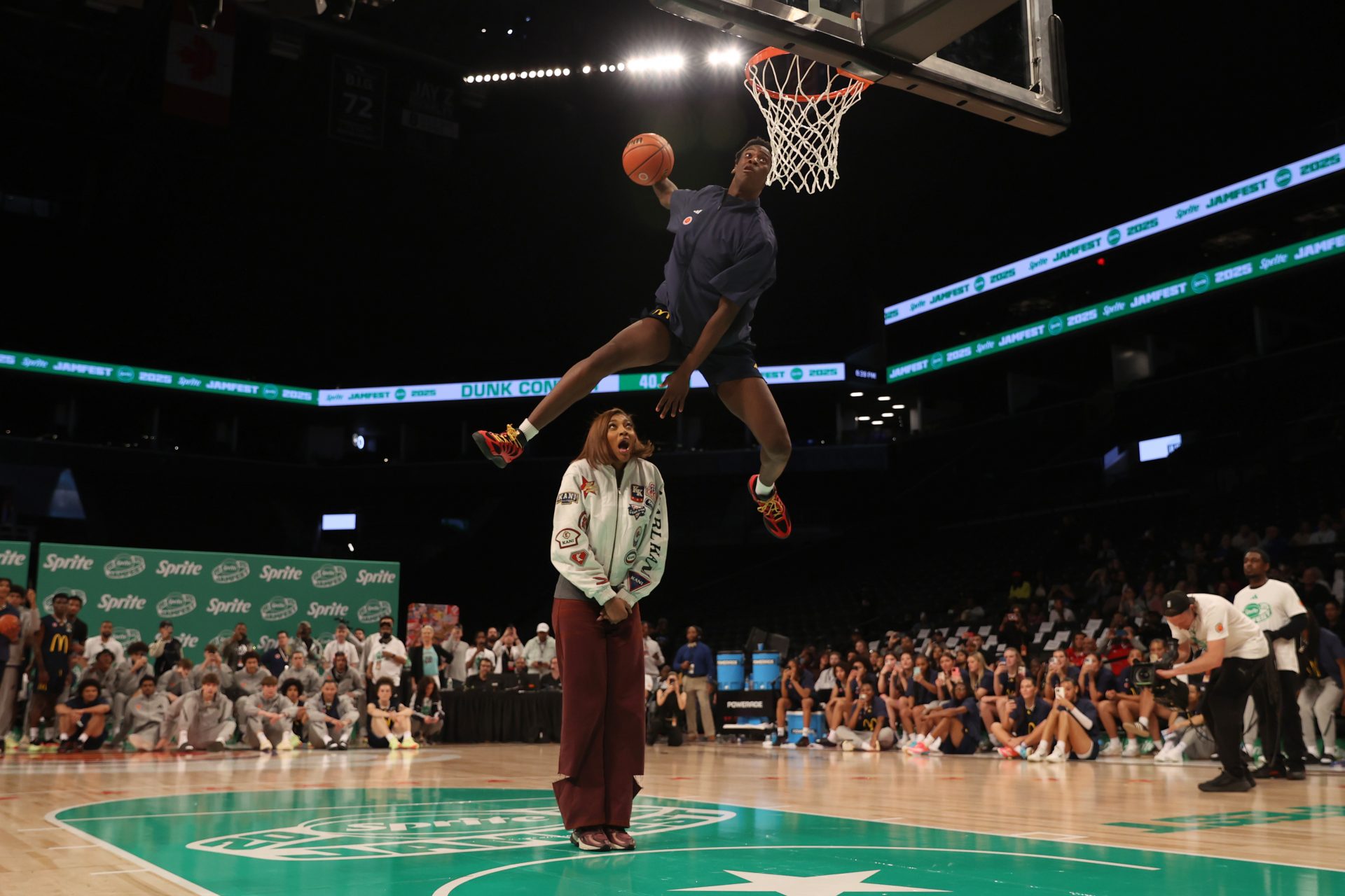 McDonald’s All American West forward AJ Dybantsa (3) dunks the ball over Chicago Sky forward Angel Reese during the Sprite Jam Fest at Barclay's Center.