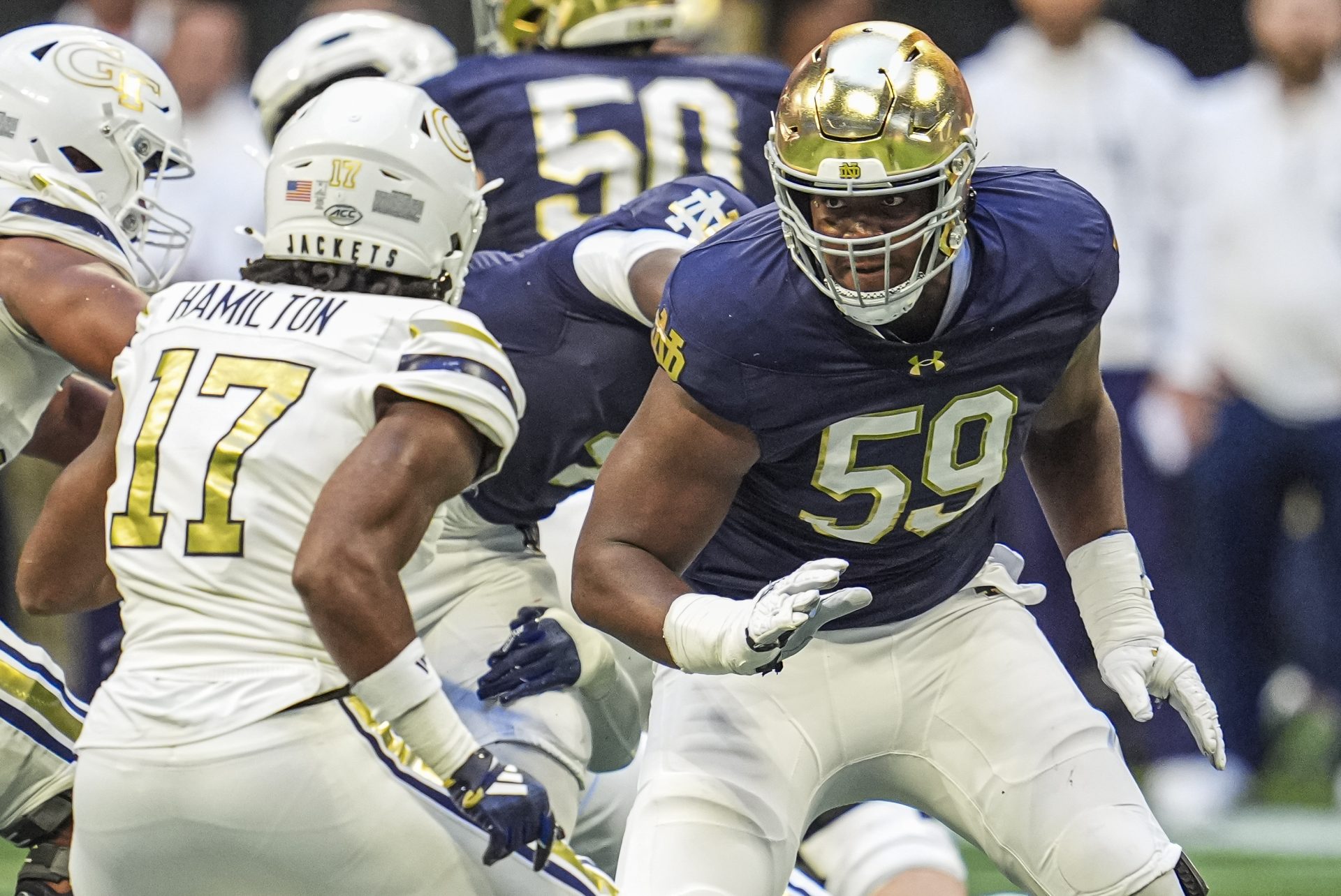 Notre Dame Fighting Irish offensive lineman Aamil Wagner (59) blocks against Georgia Tech Yellow Jackets linebacker Jackson Hamilton (17) at Mercedes-Benz Stadium.