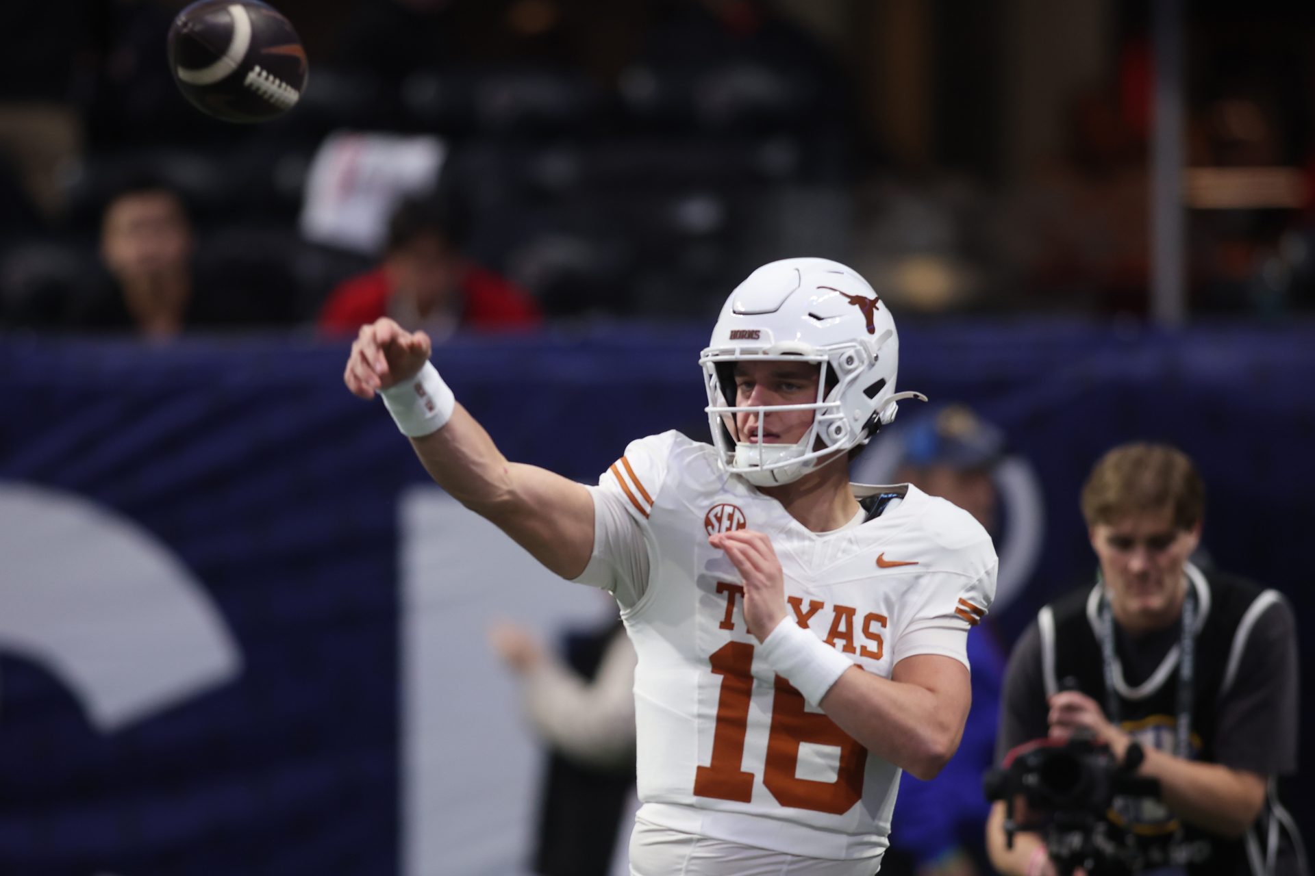 Texas Longhorns quarterback Arch Manning (16) practices before the 2024 SEC Championship game at Mercedes-Benz Stadium.