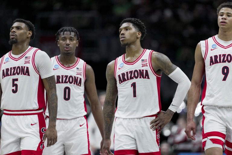 Members of the Arizona Wildcats stand on the court against the Oregon Ducks in the second half at Climate Pledge Arena.