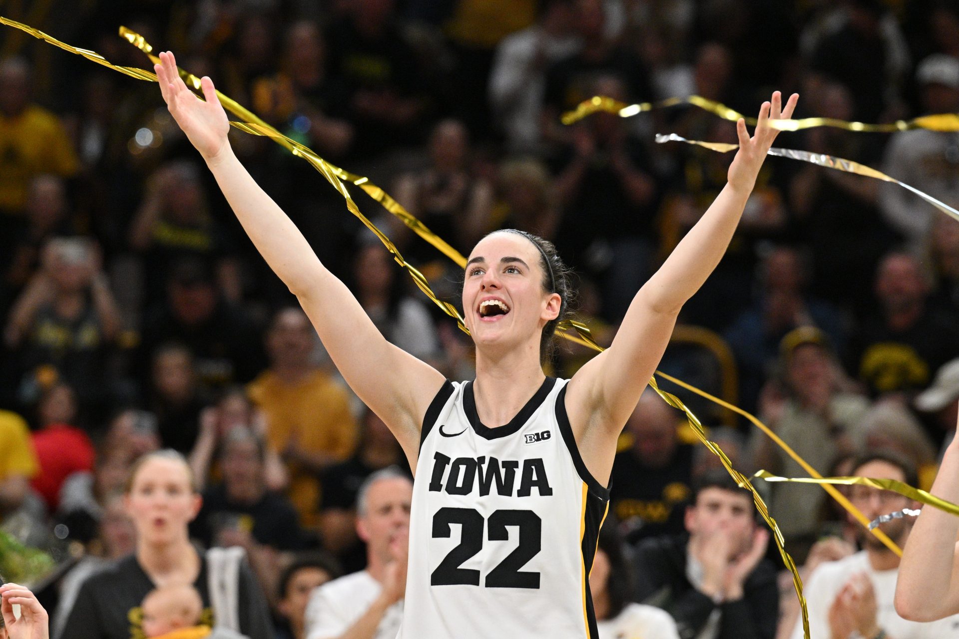 Iowa Hawkeyes guard Caitlin Clark (22) reacts during senior day after the game against the Ohio State Buckeyes. Clark broke the NCAA basketball all-time scoring record during the second quarter.