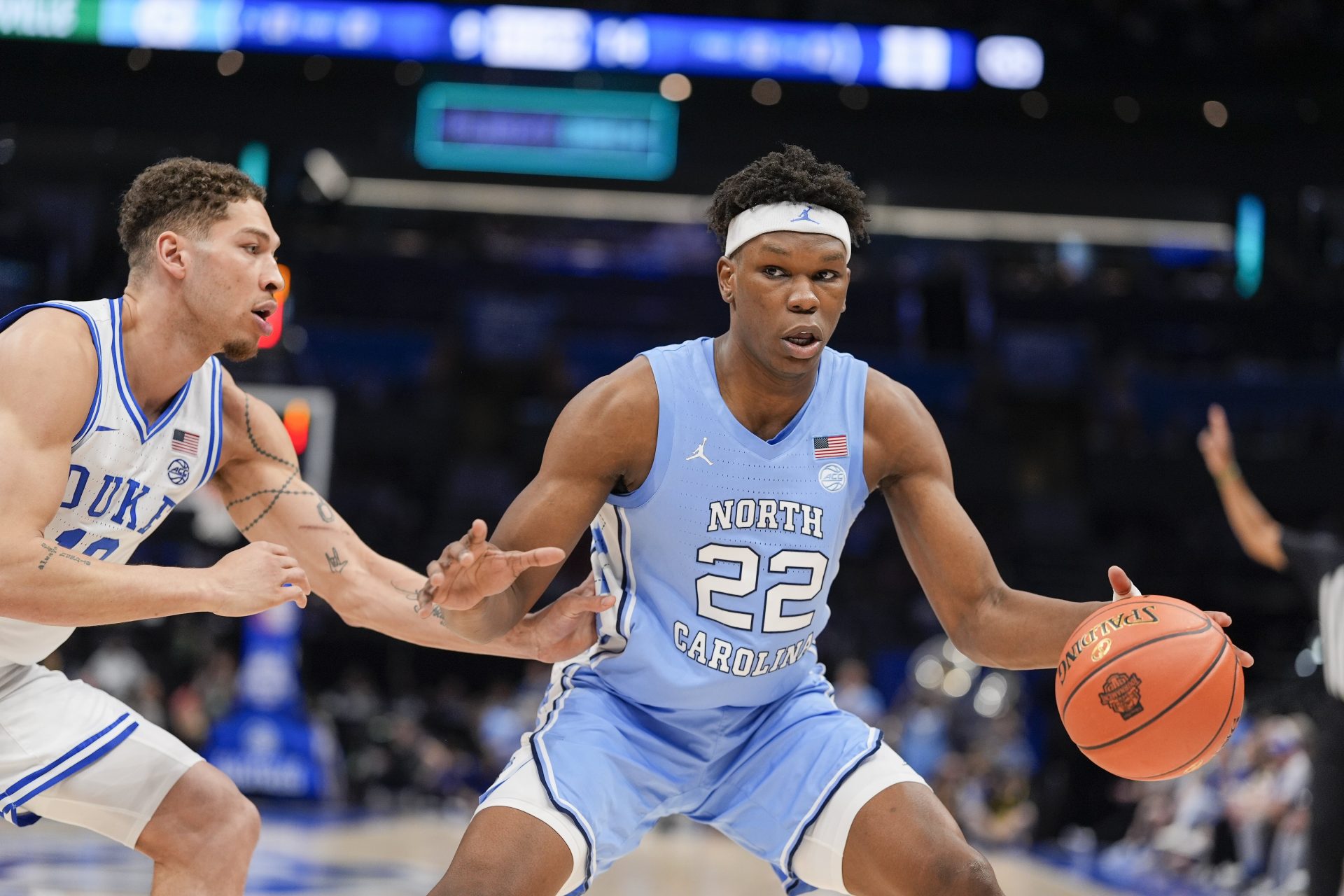 North Carolina Tar Heels forward Ven-Allen Lubin (22) handles the ball against Duke Blue Devils forward Mason Gillis (18) during the first half at Spectrum Center.