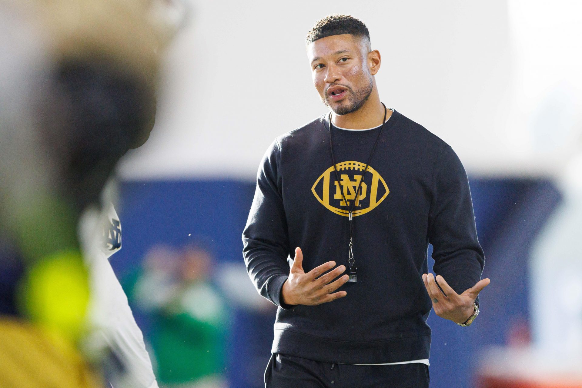 Notre Dame head coach Marcus Freeman greets his players during a Notre Dame football spring practice