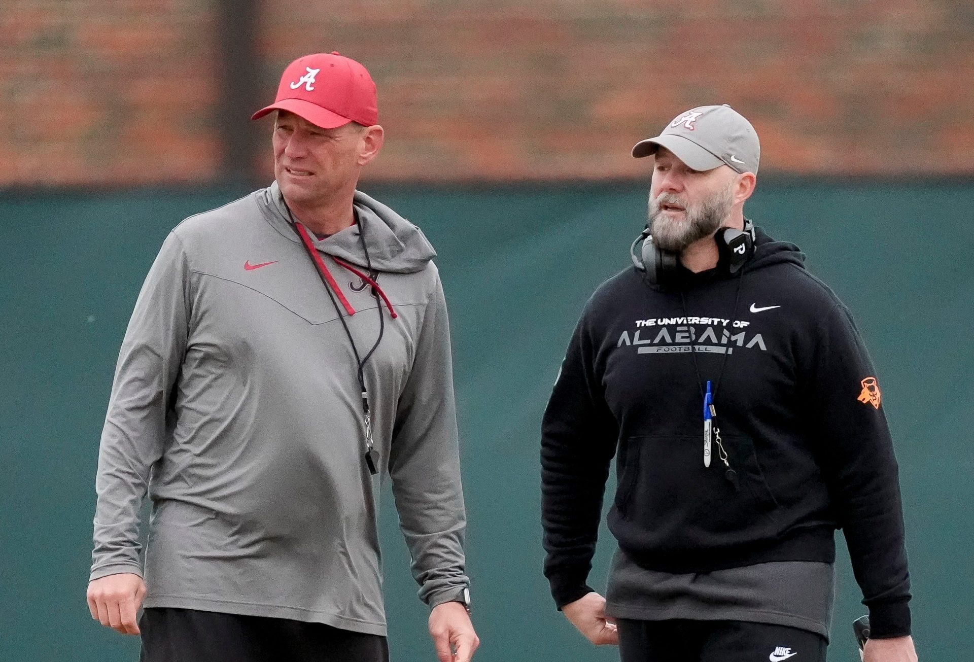 Head coach Kalen DeBoer and Offensive Coordinator Ryan Grubb watch the offense work during Spring Practice for the Crimson Tide.