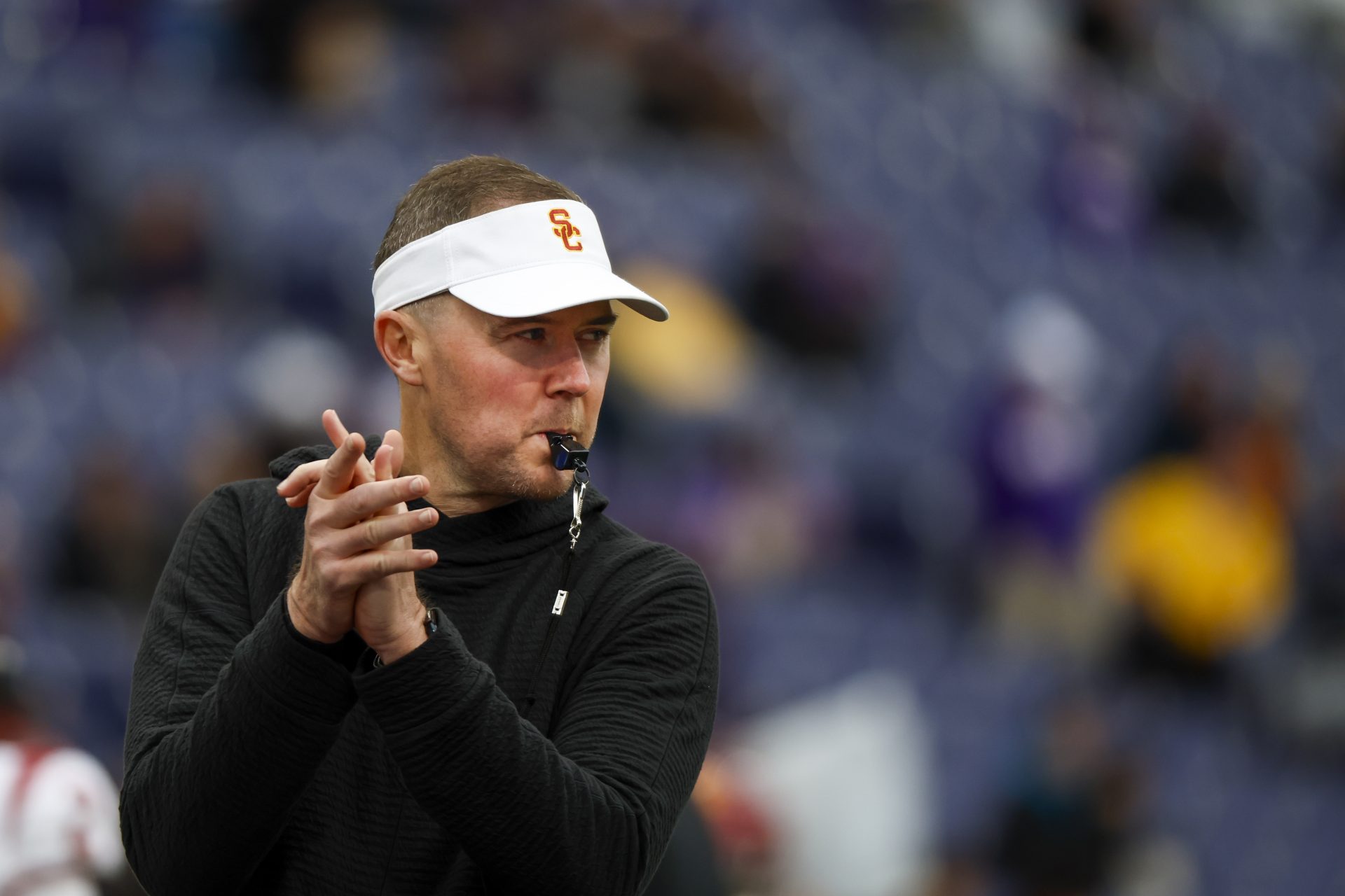 USC Trojans head coach Lincoln Riley watches pregame warmups against the Washington Huskies at Alaska Airlines Field at Husky Stadium.