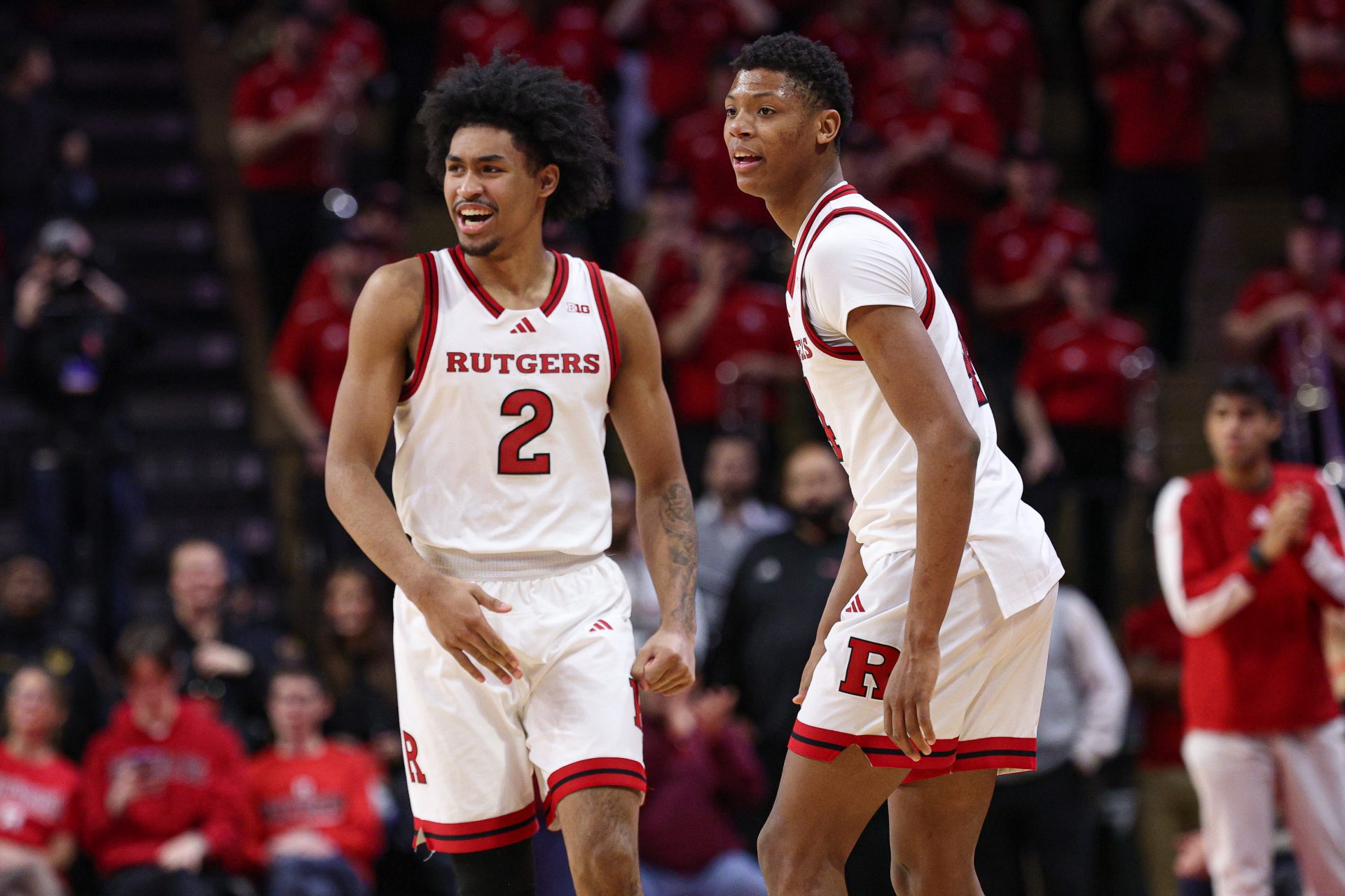 Rutgers Scarlet Knights guard Dylan Harper (2) celebrates in front of guard Ace Bailey (4) during the second half against the UCLA Bruins at Jersey Mike's Arena.